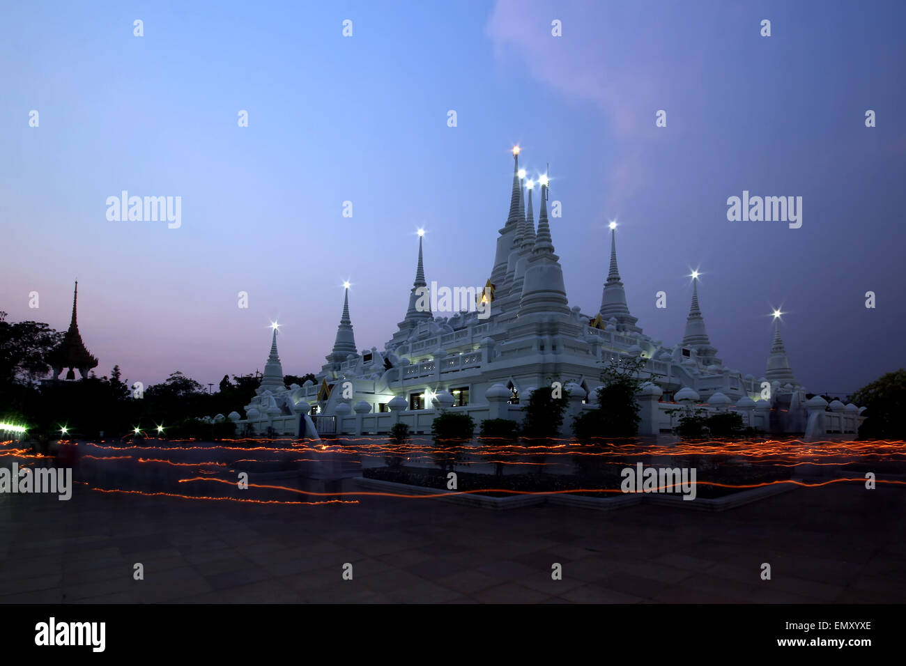 The thai culture walk with lighted candles in hand around a temple(wian tian) Stock Photo