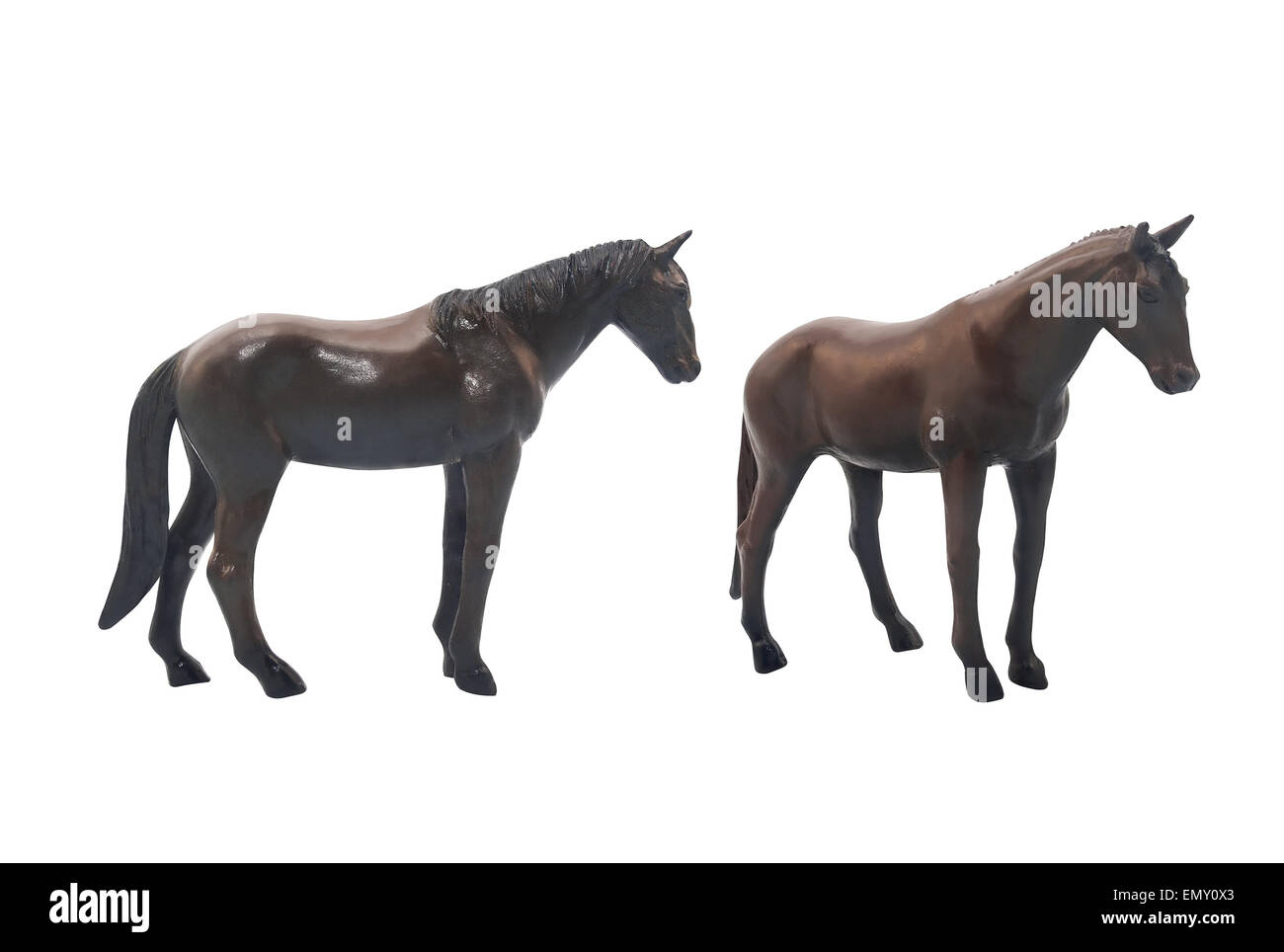 Isolated dark brown horse toy standing on white background profile and angle view. Stock Photo