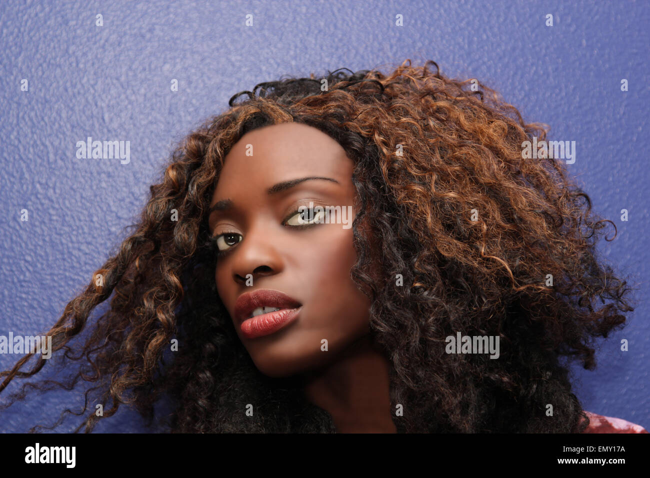 Black woman with unusual wavy hair and sultry eyes. Stock Photo
