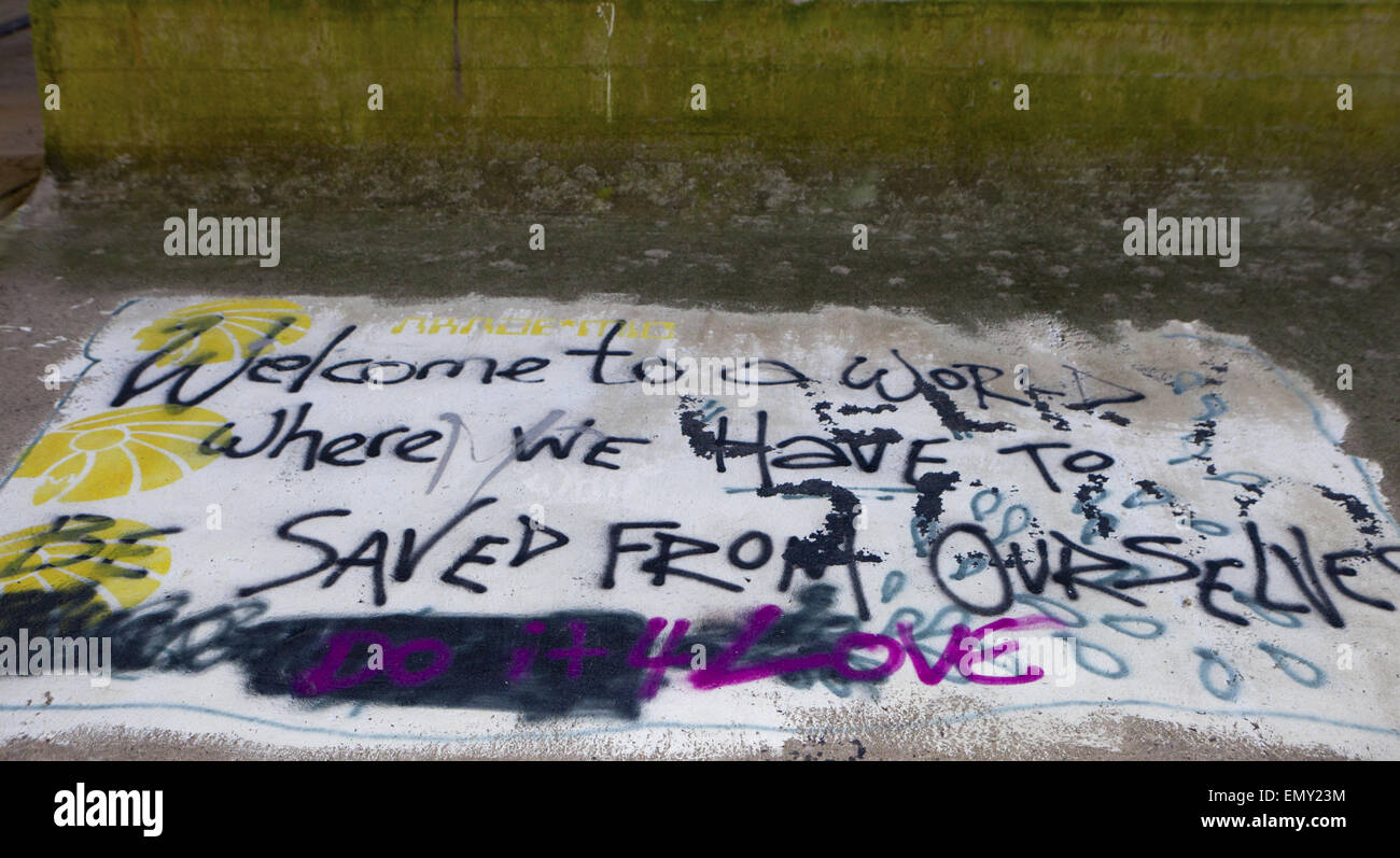 ' Saved from Ourselves' _Graffiti on the underpass of the M6 Bridge at Denny Beck, Lancaster, Lancashire, UK Stock Photo