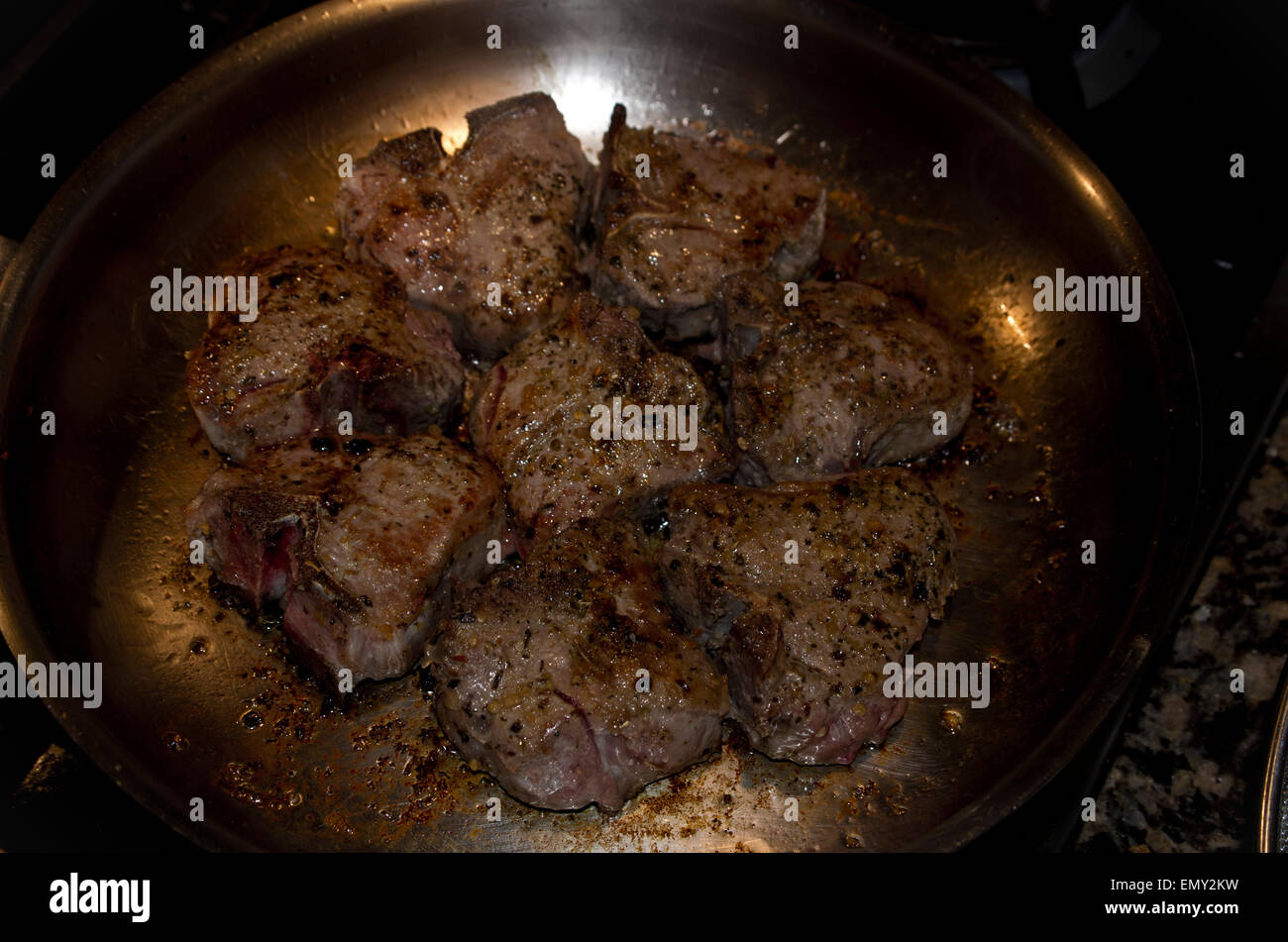 Seasoned Lamb chops in a frying pan Stock Photo - Alamy
