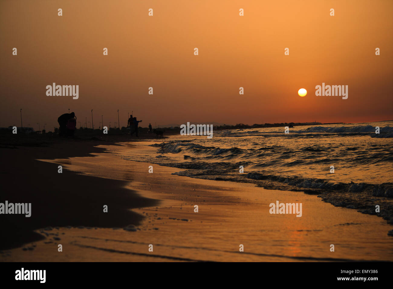 Golden sunset view on the beach Stock Photo - Alamy