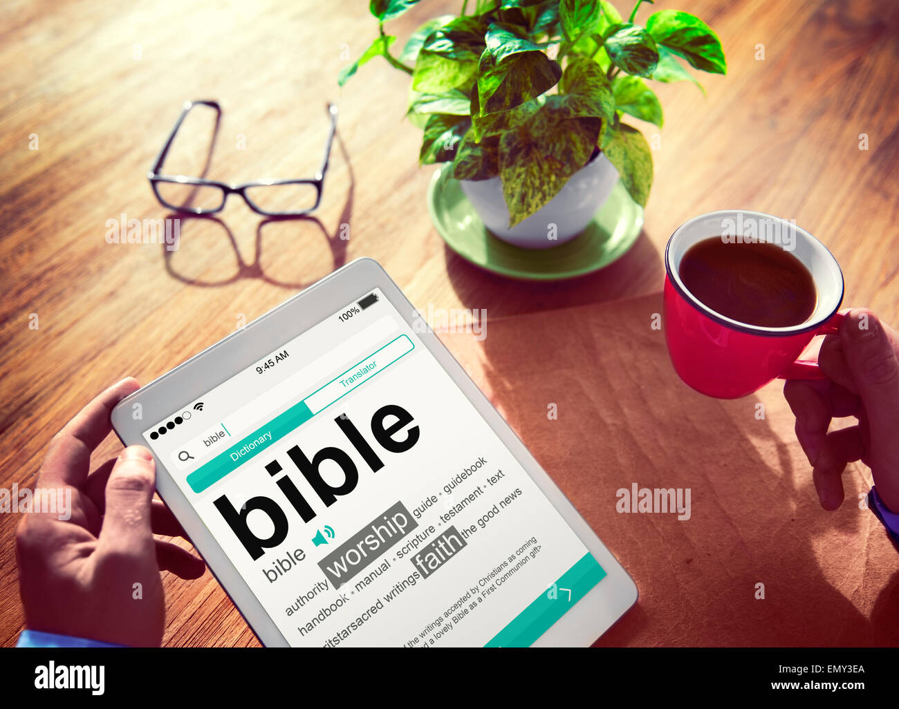Man Reading the Definition of Bible Stock Photo