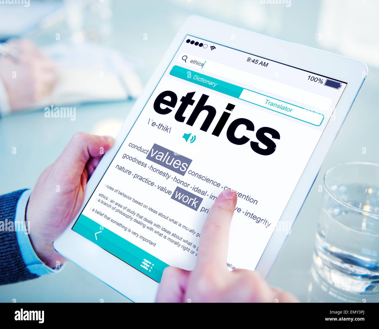 Man Reading the Definition of Ethics Stock Photo