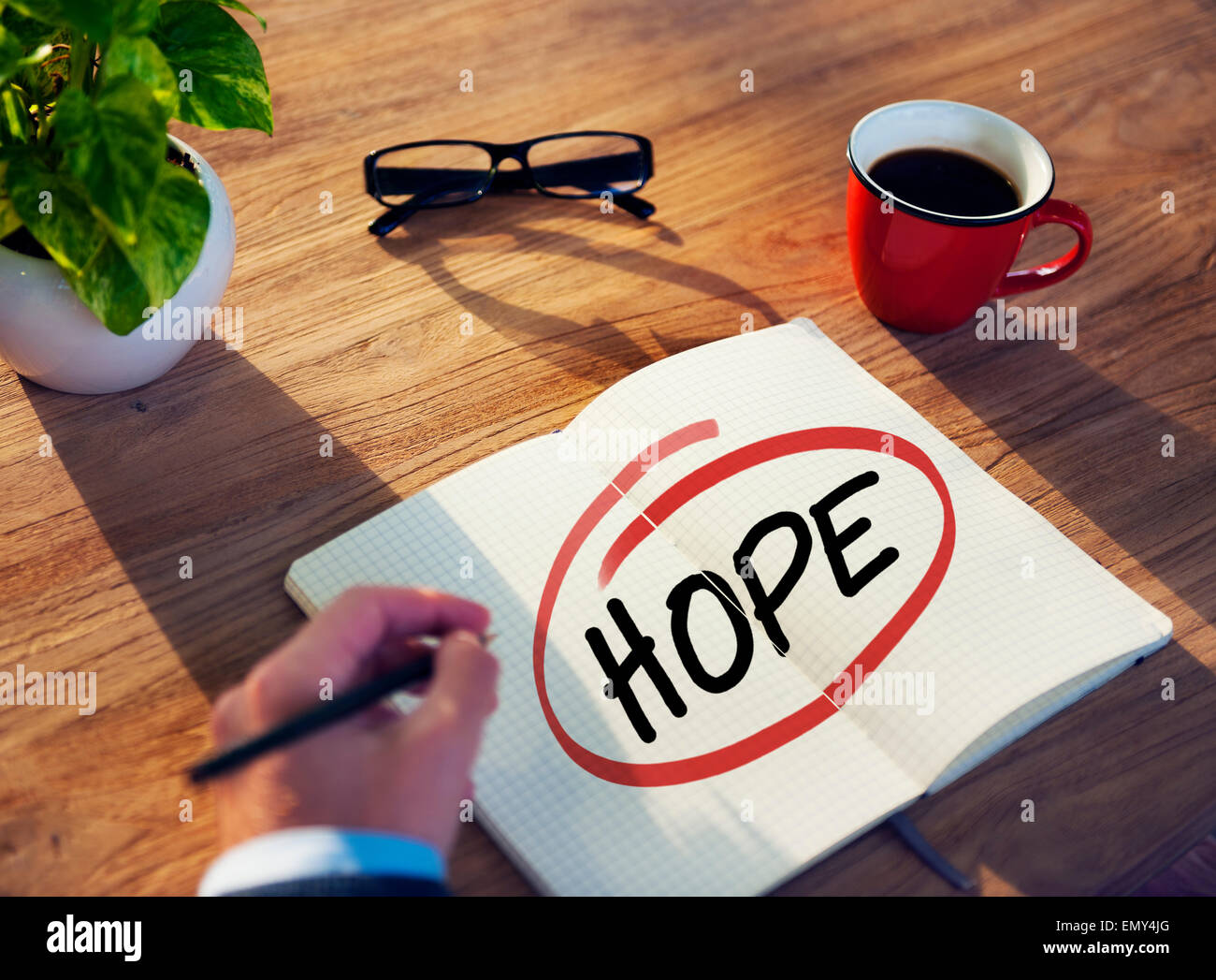 Man with Note Pad and Hope Concept Stock Photo