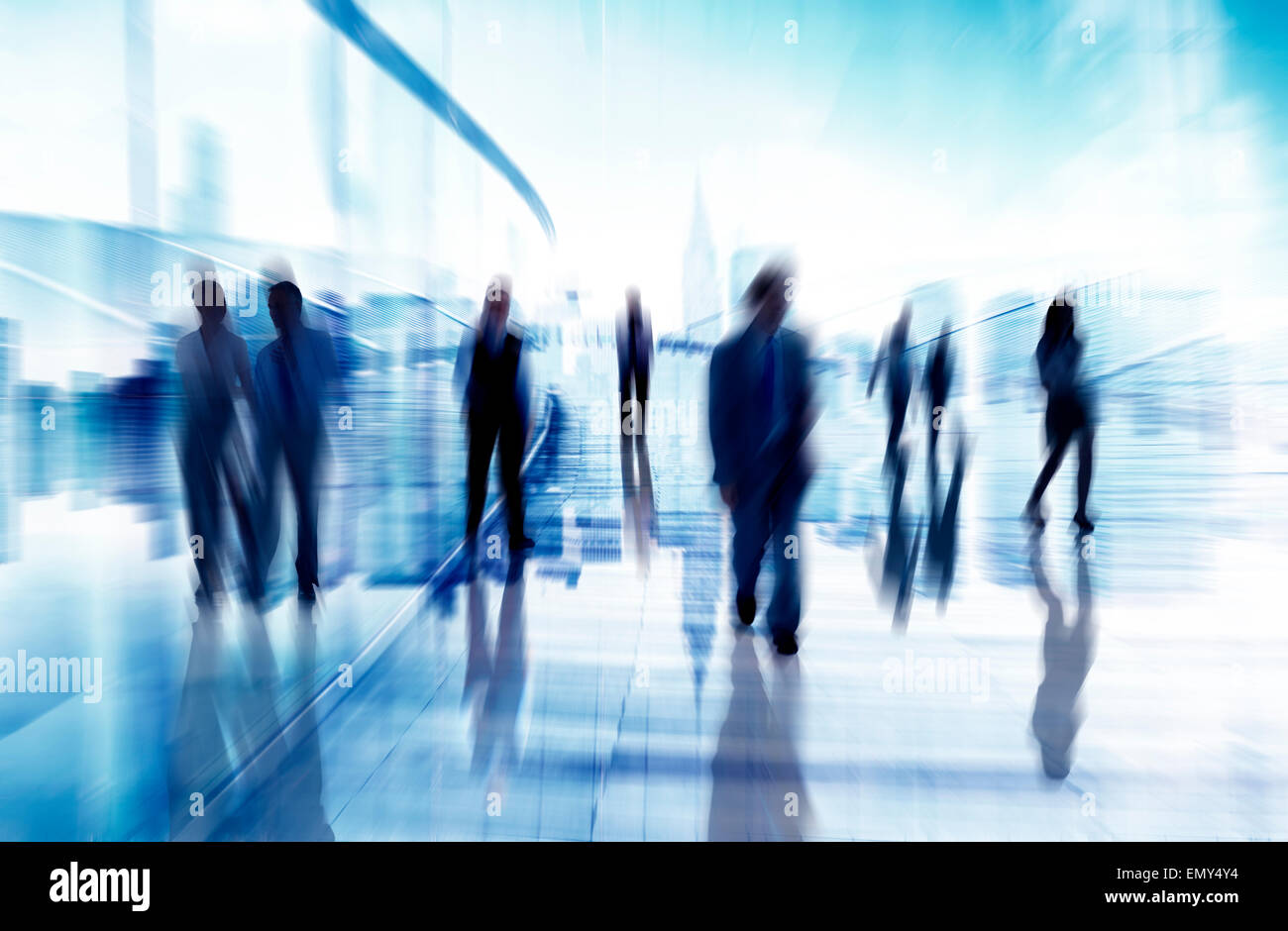 Silhouettes of Business People in Blurred Motion Walking Stock Photo ...