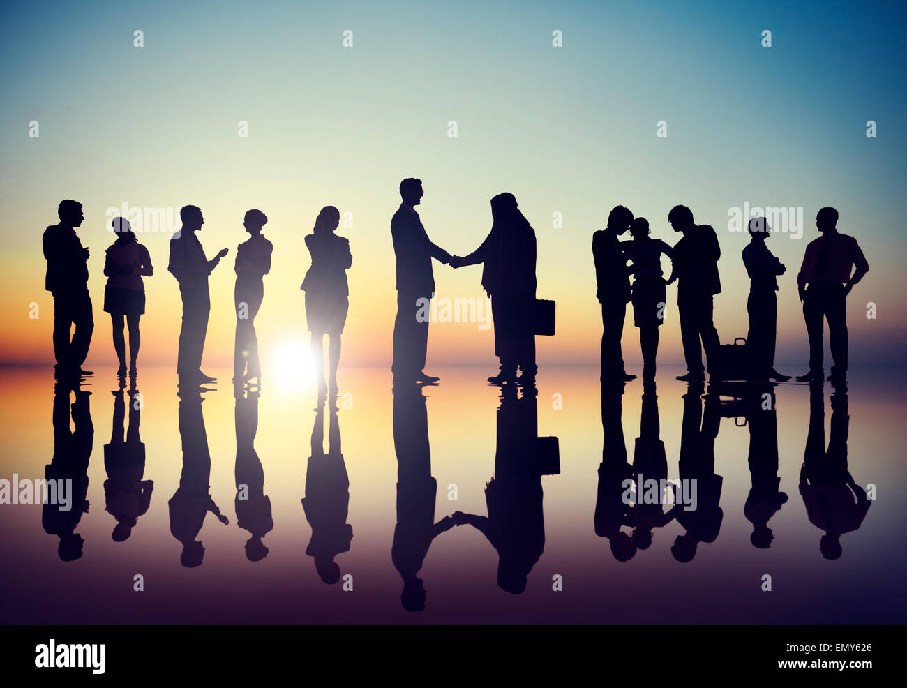 Group of Business People in Back Lit Stock Photo