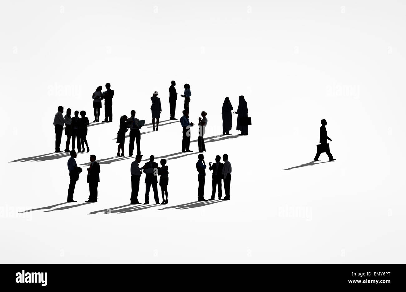 Lone Silhouettes Of A Business Man Walking Away From The Group Of Silhouettes Of Business People. Stock Photo