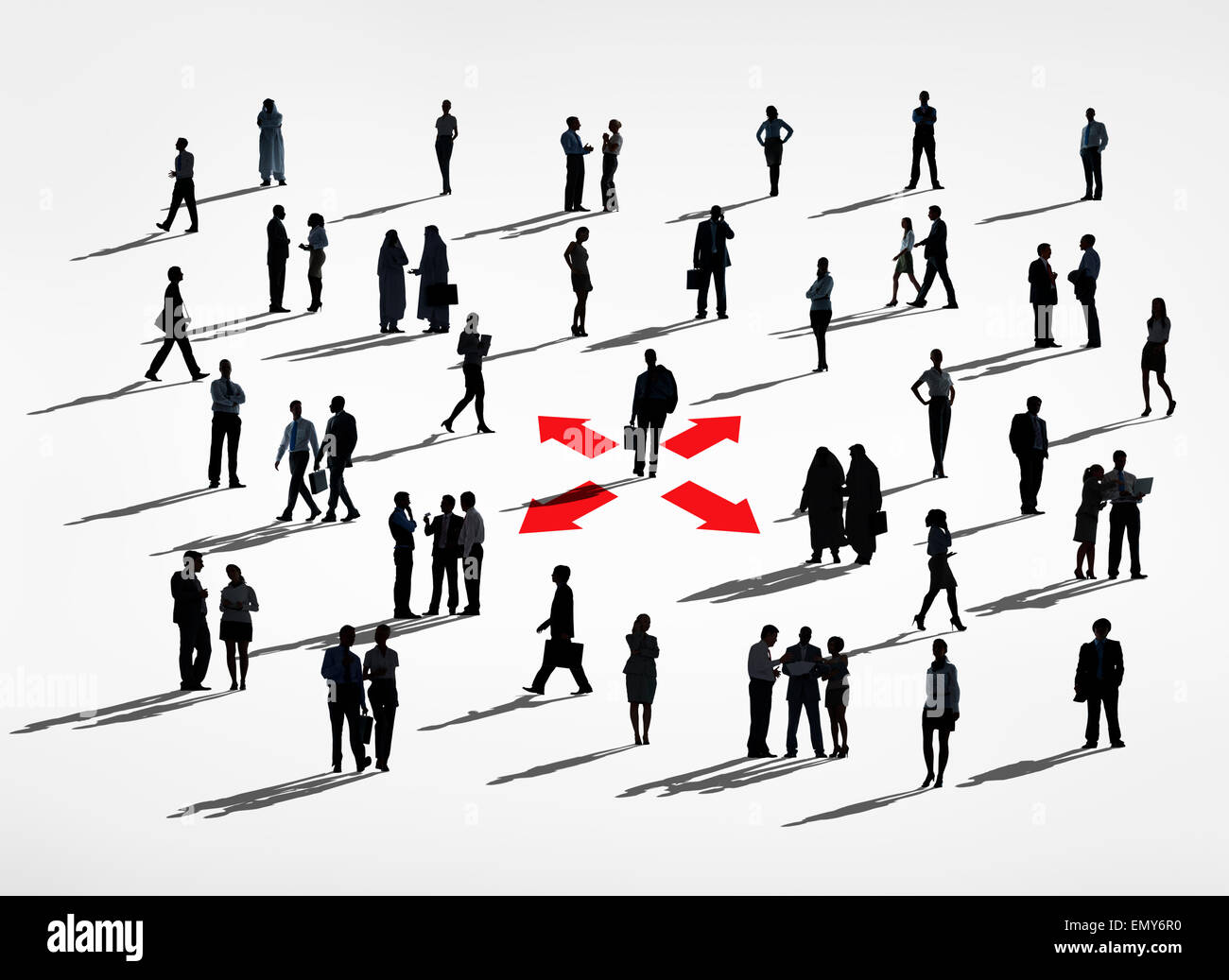 Lone Silhouettes Of A Business Man In A Center Amongst Group Of Silhouettes Of Business People. Stock Photo