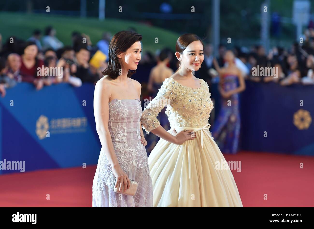 Beijing, China. 23rd April, 2015. Actresses Tong Lei(L) and Hai Lu walk