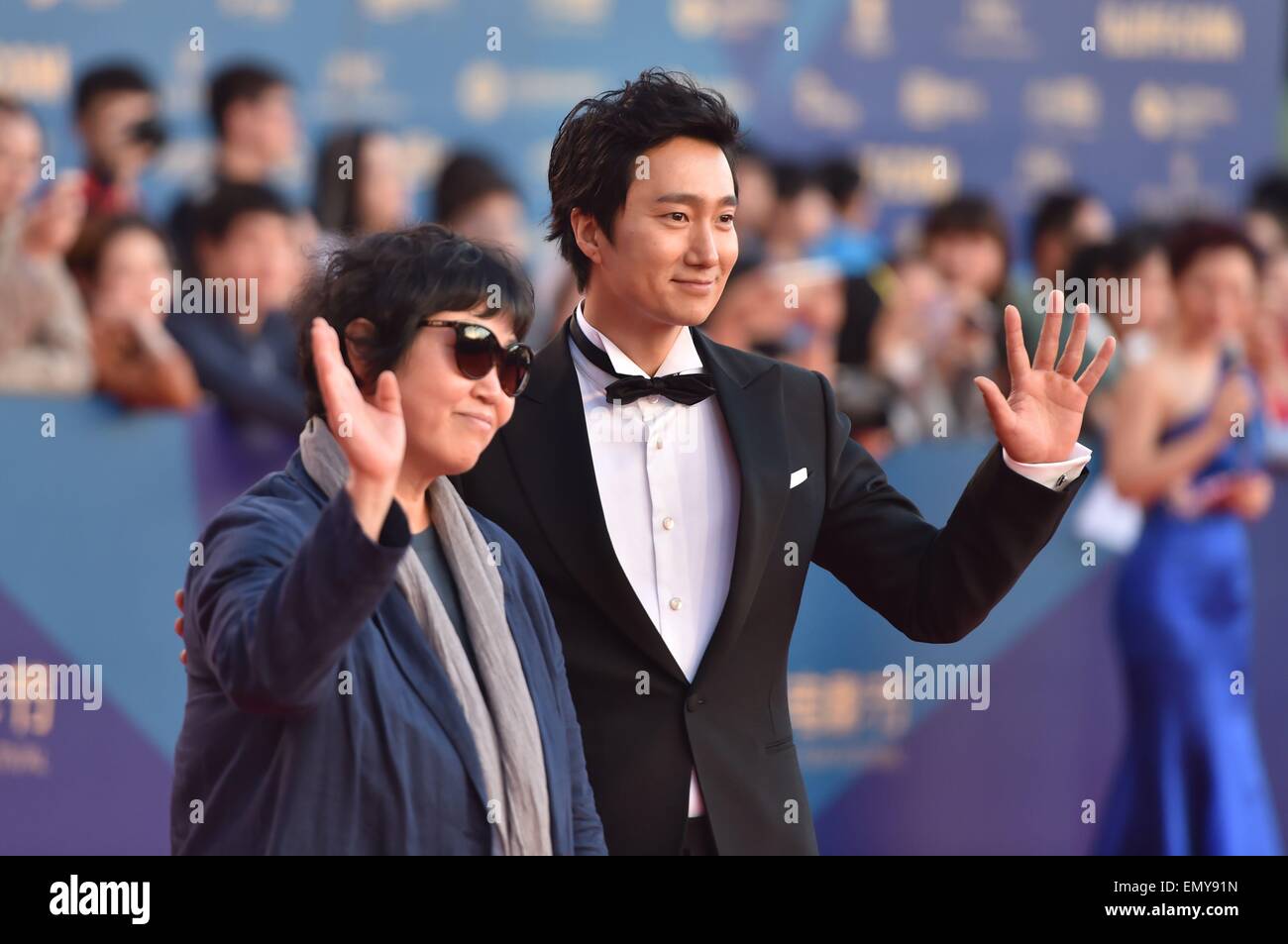 Beijing, China. 23rd April, 2015. South Korean movie ''Whistle Blower'' director Soonrye Yim and actor Park hae il walk the red carpet during the closing ceremony of the 5th Beijing International Film Festival. Credit:  SIPA Asia/ZUMA Wire/Alamy Live News Stock Photo