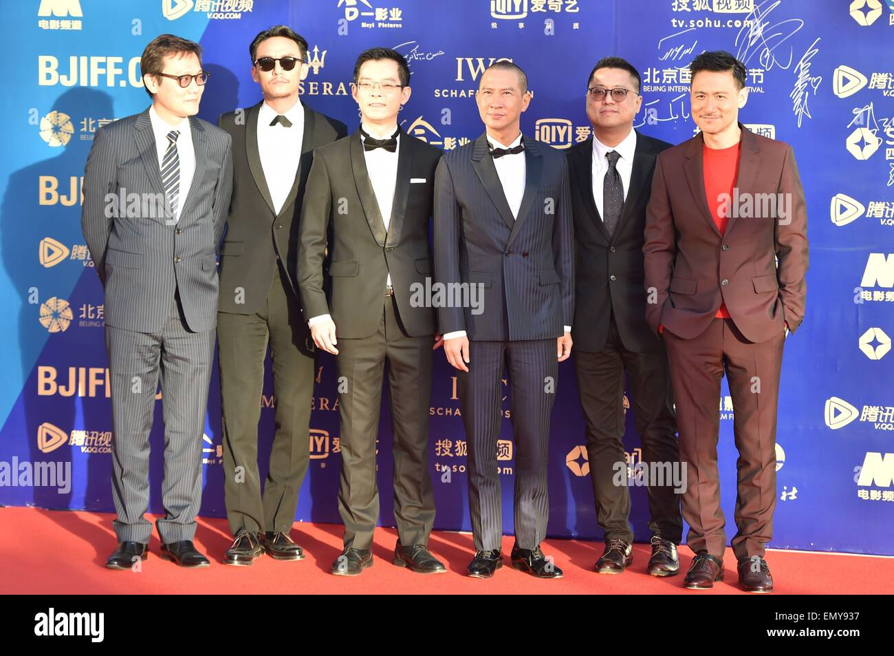 Beijing, China. 23rd April, 2015. Cast members of the movie ''Helios'' pose for photos during the closing ceremony of the 5th Beijing International Film Festival. Directors Lok Man Leung(2R) and Lu Jianqing(1L), actors Chang Chen(2L), Nick Cheung(4L), Jacky Cheung Credit:  SIPA Asia/ZUMA Wire/Alamy Live News Stock Photo