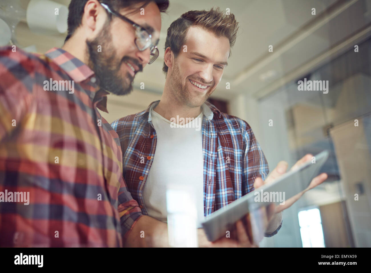 Modern businessmen with touchpad working with electronic documents Stock Photo