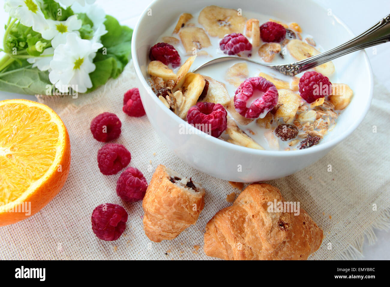 Bowl with cereals with raspberry and banana chips Stock Photo Alamy
