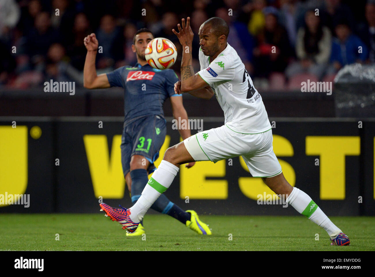 Naples, Italy. 23rd Apr, 2015. Wolfsburg's Naldo (R) and Faouzi Ghoulam of SSC Napoli in action during the UEFA Europa League quarter final second leg soccer match between SSC Napoli and VfL Wolfsburg at San Paolo stadium in Naples, Italy, 23 April 2015. Photo: Peter Steffen/dpa/Alamy Live News Stock Photo