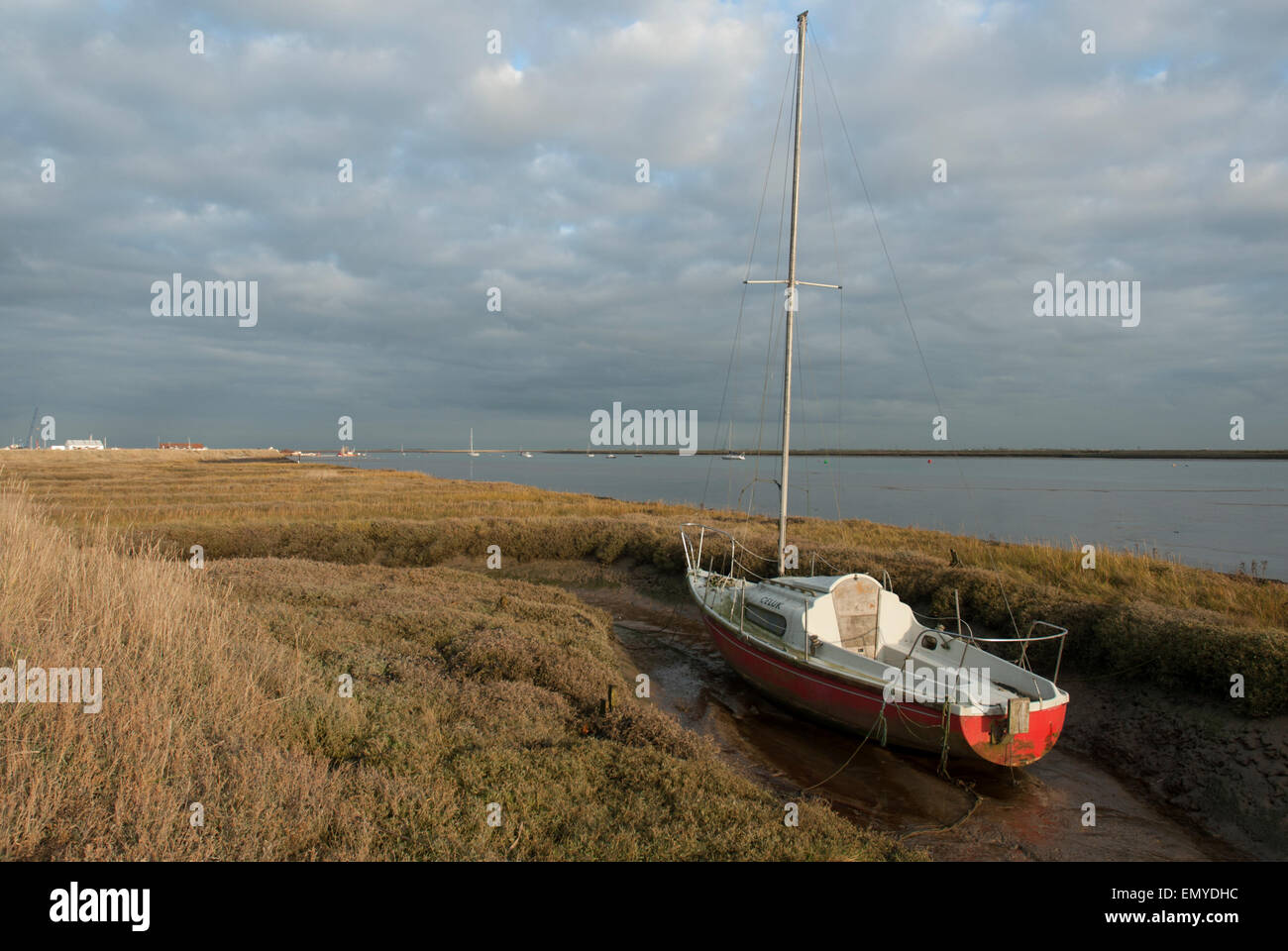 Sail boat stranded in Essex Creek Stock Photo