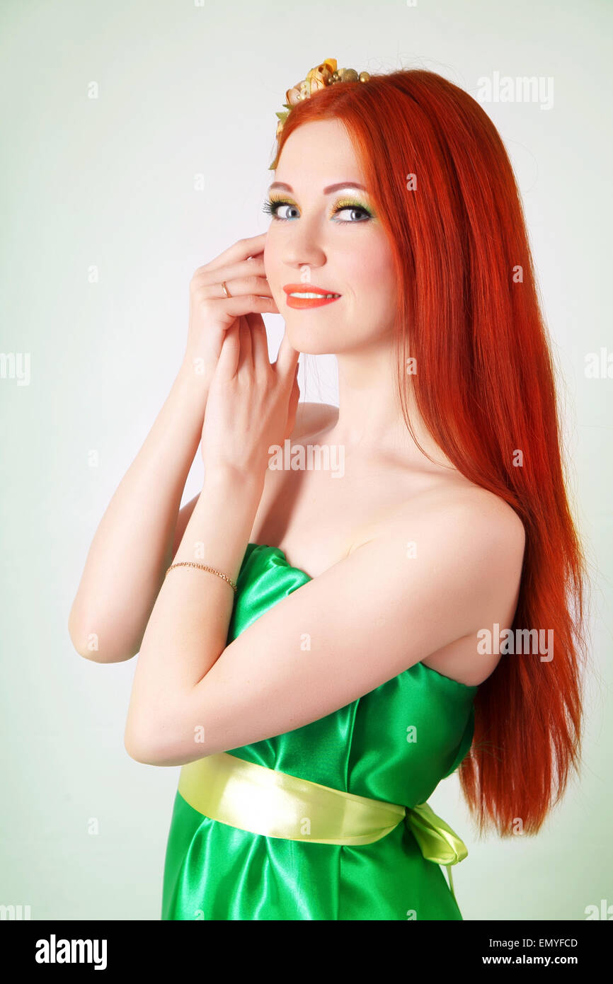 Portrait of beautiful red-haired girl with flowers in hair Stock Photo ...