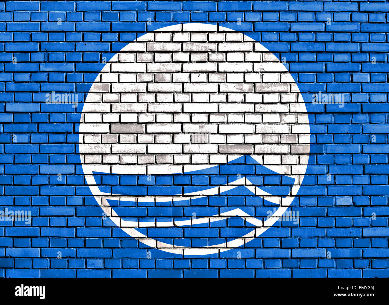 Blue flag painted on brick wall Stock Photo