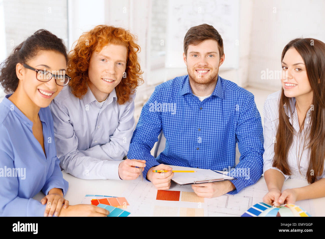 team with color samples and blueprint at office Stock Photo - Alamy