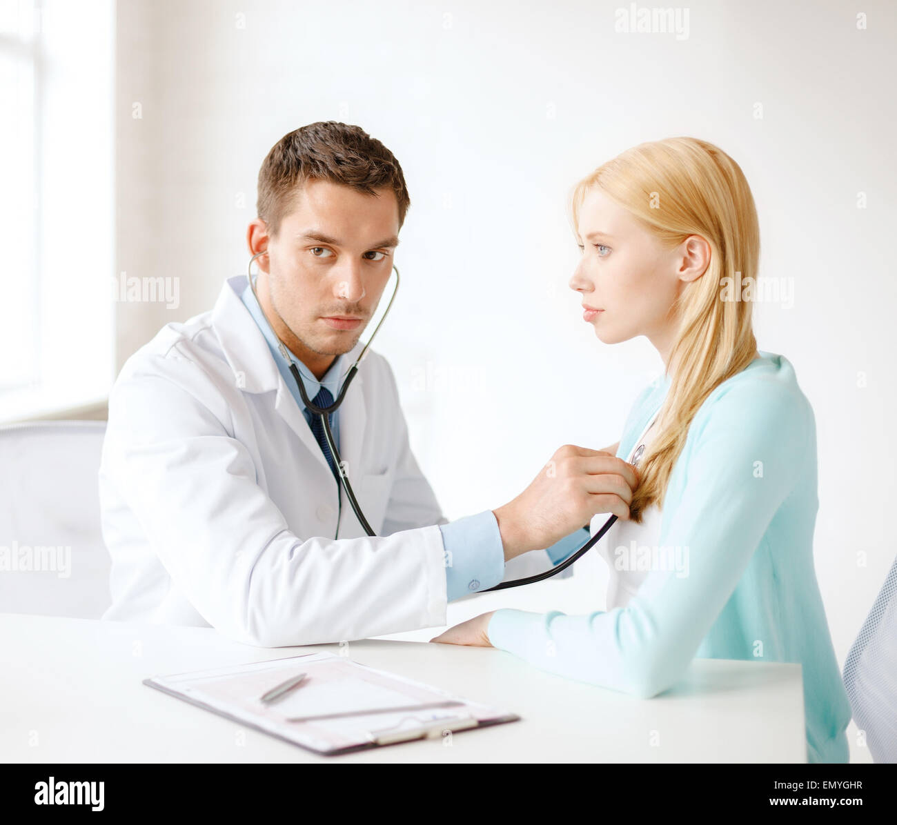 doctor with stethoscope listening to the patient Stock Photo - Alamy