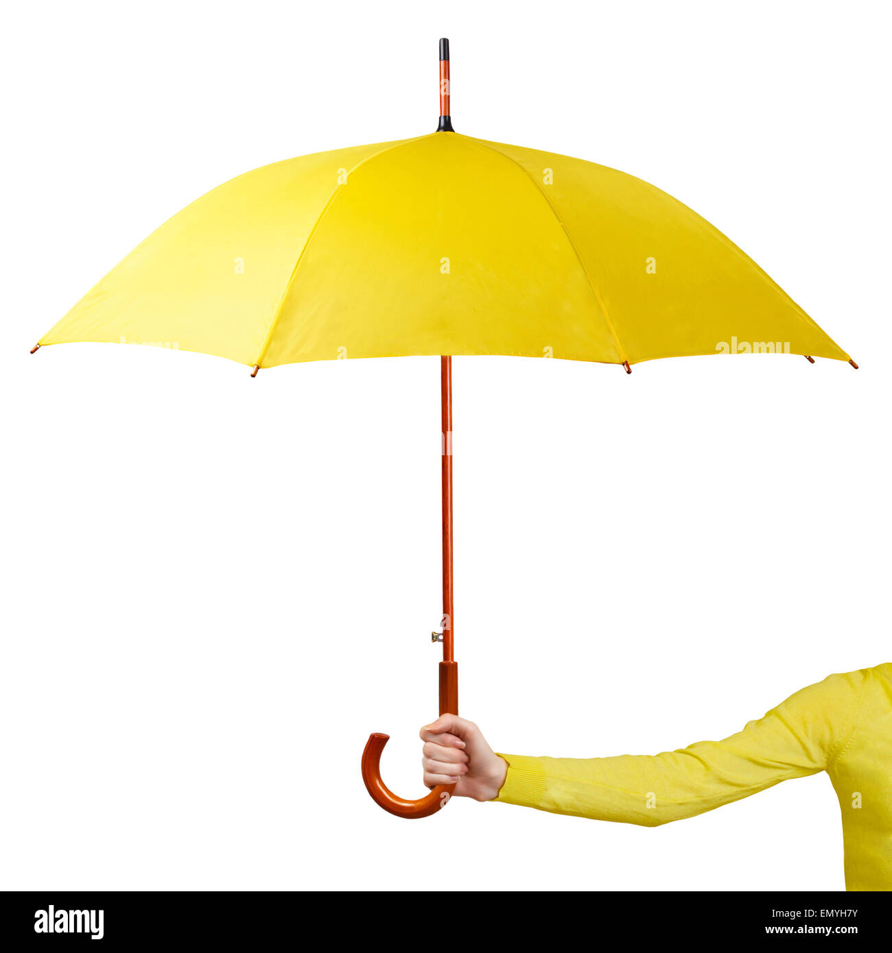 Hand holding a yellow umbrella isolated on white background Stock Photo