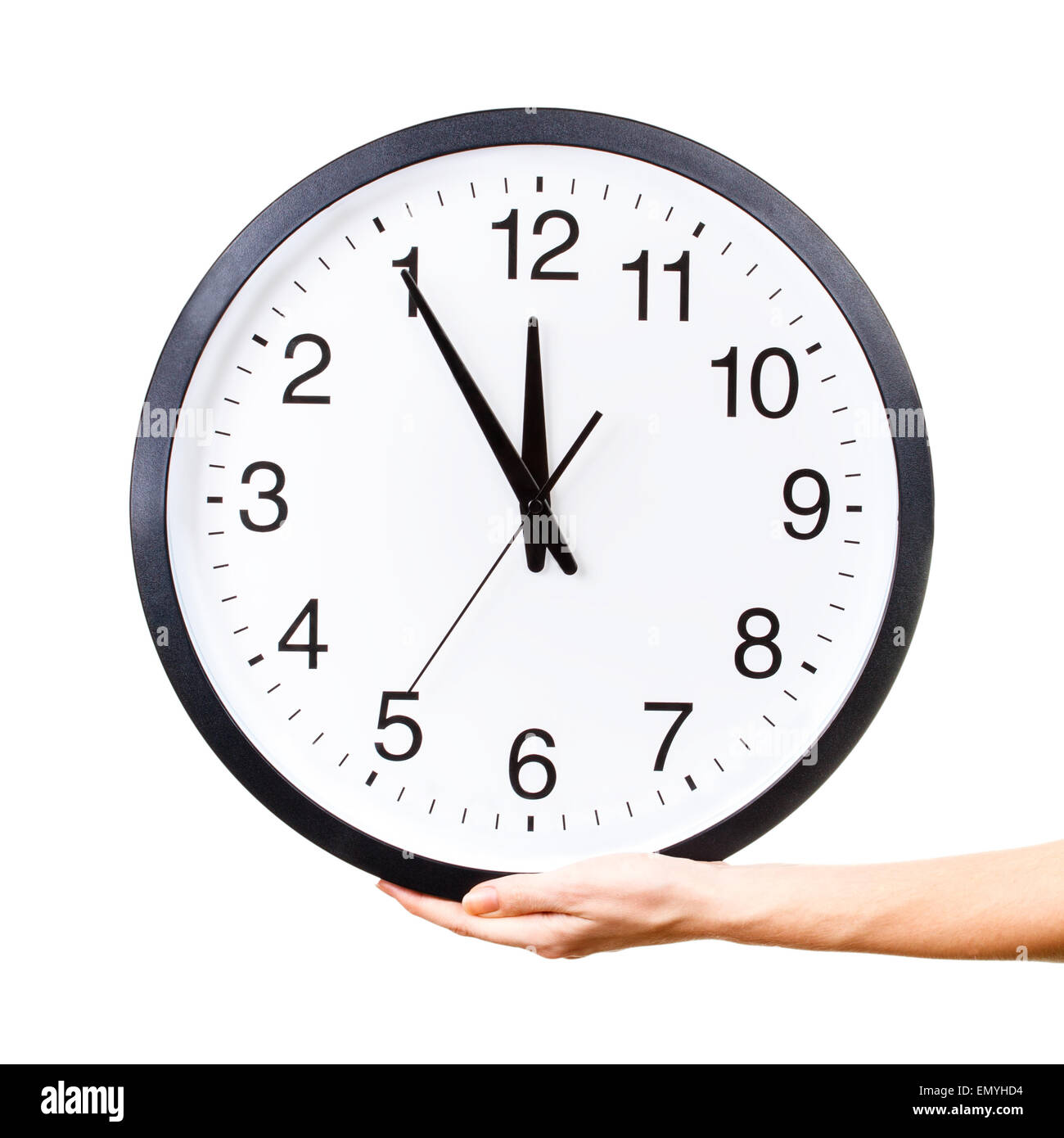 Woman's hand holding a big clock isolated on a white background Stock