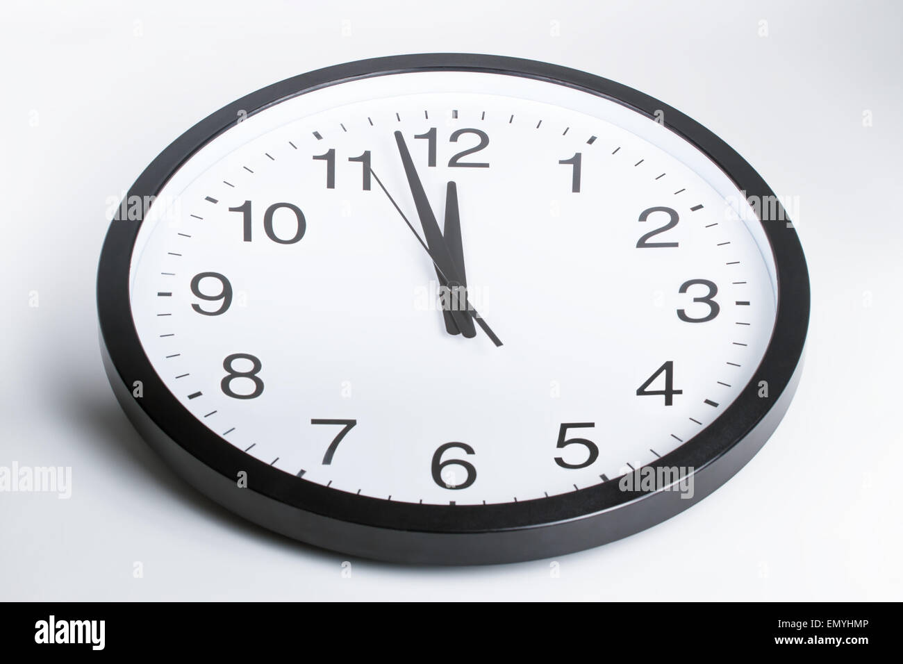 Clock showing the hands at two minutes to midnight Stock Photo