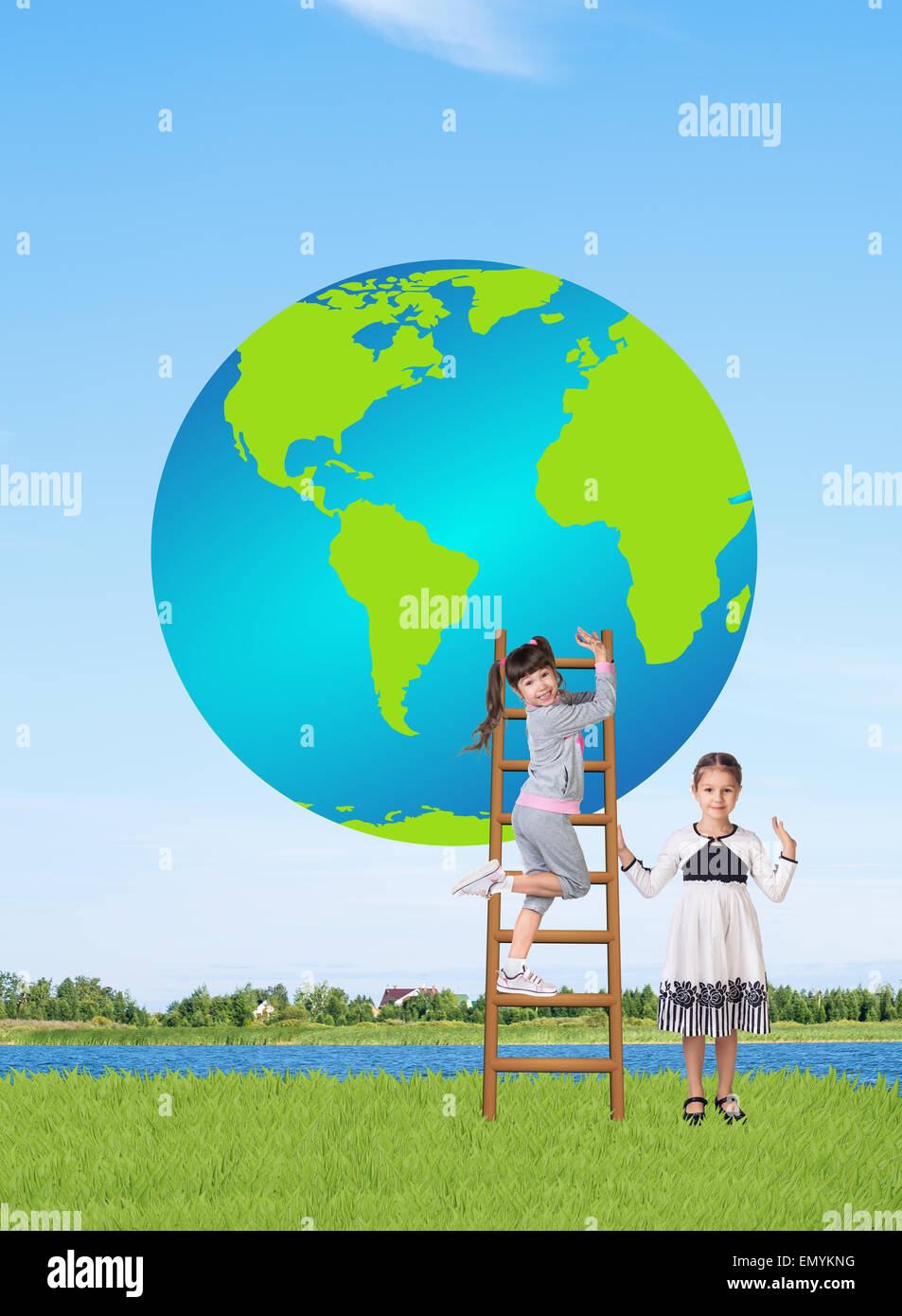 Little smiling girls with a globe Stock Photo