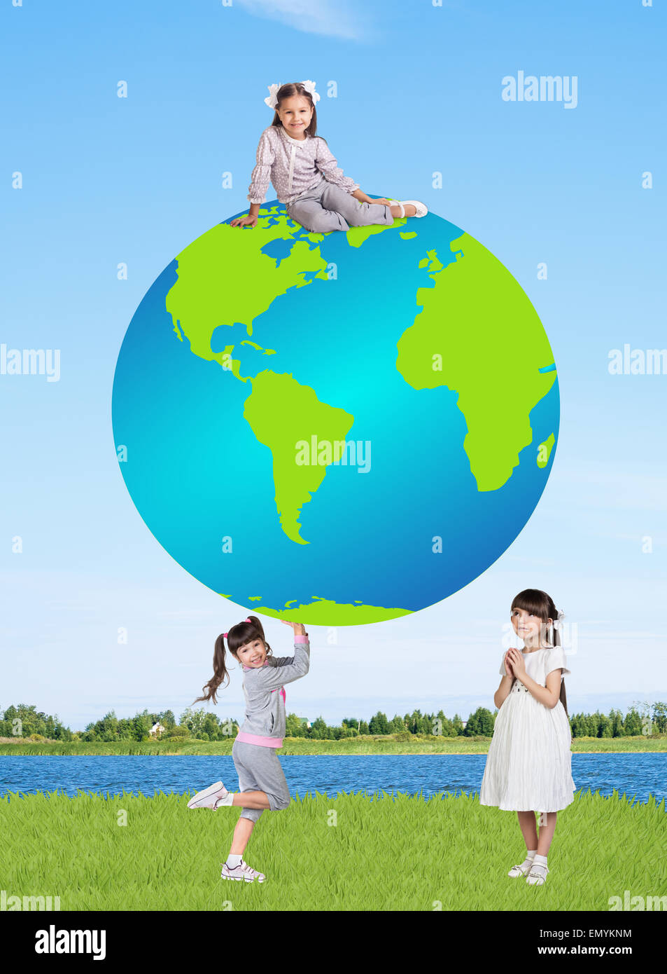 Little smiling girls with a globe Stock Photo