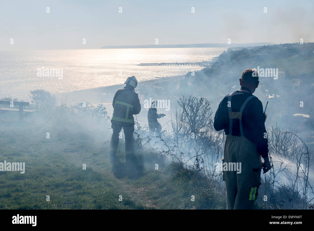 Firefighters tackling a gorse and grassland fire on the East Hill, Hastings. East Sussex. Stock Photo
