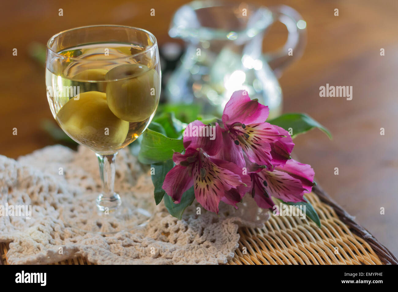 Sweet Japanese plum wine with fruit in glass photographed with