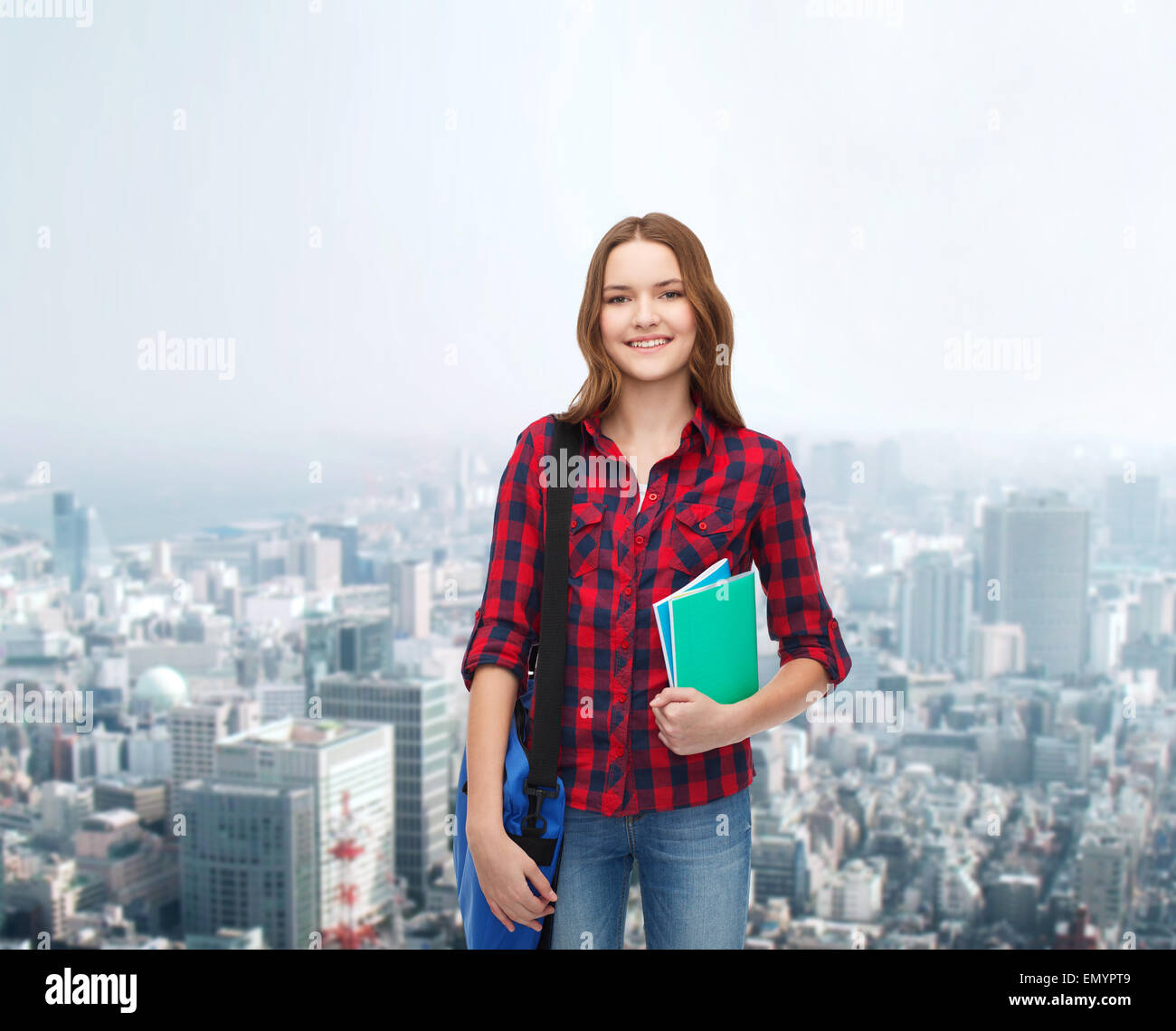smiling female student with bag and notebooks Stock Photo - Alamy