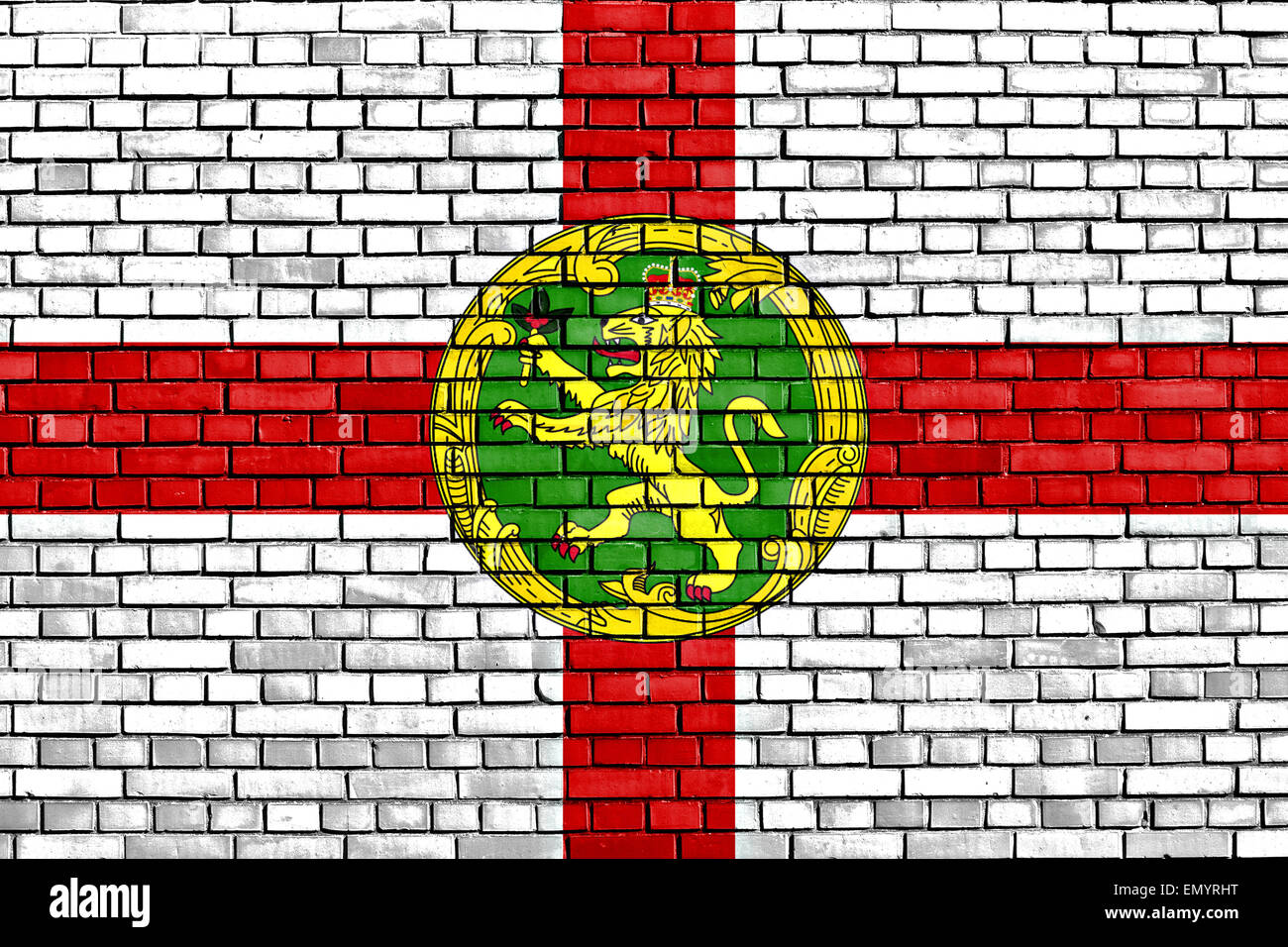 flag of Alderney painted on brick wall Stock Photo