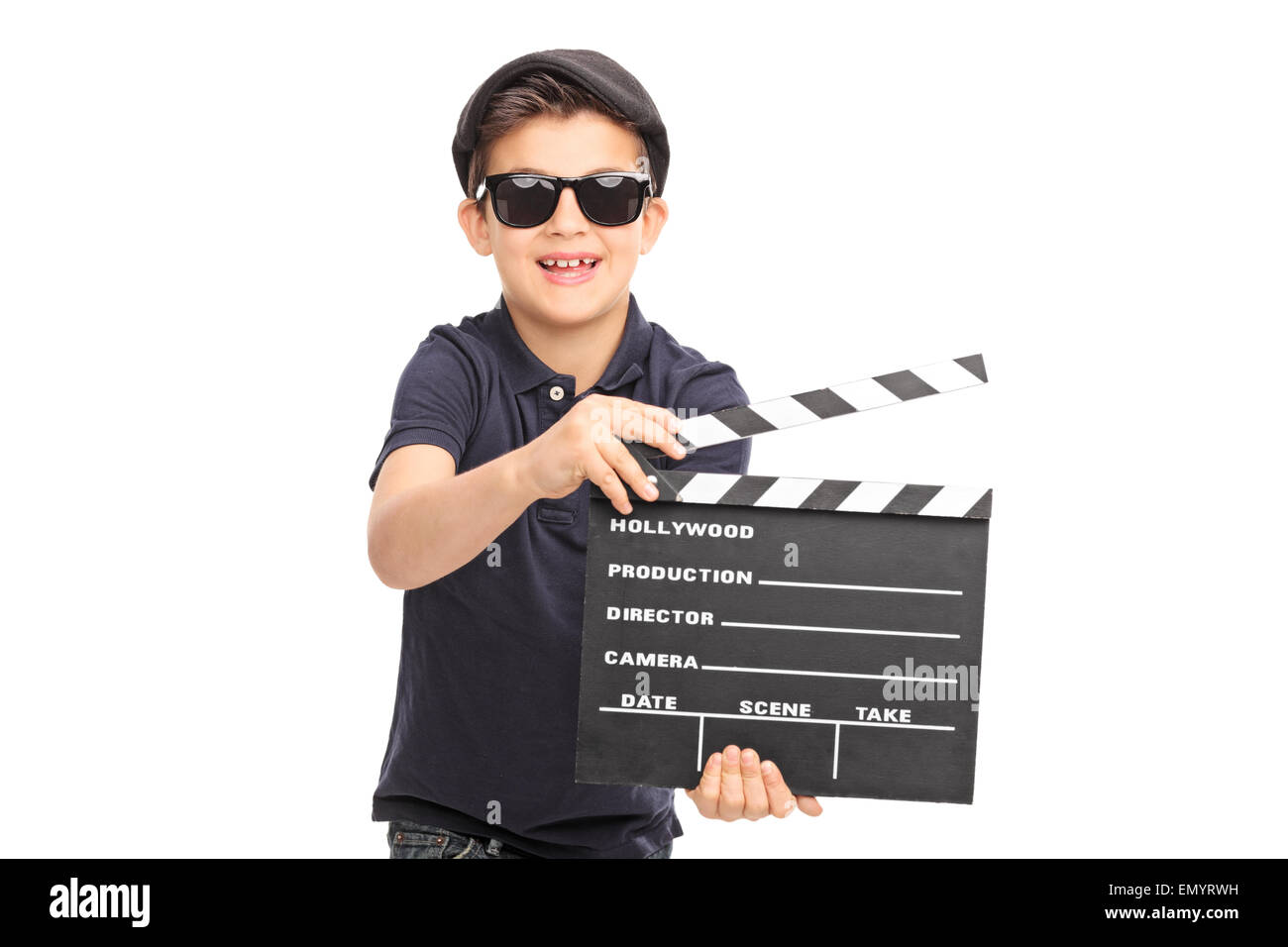 Little boy with sunglasses and a black beret having fun with a movie clapperboard isolated on white background Stock Photo