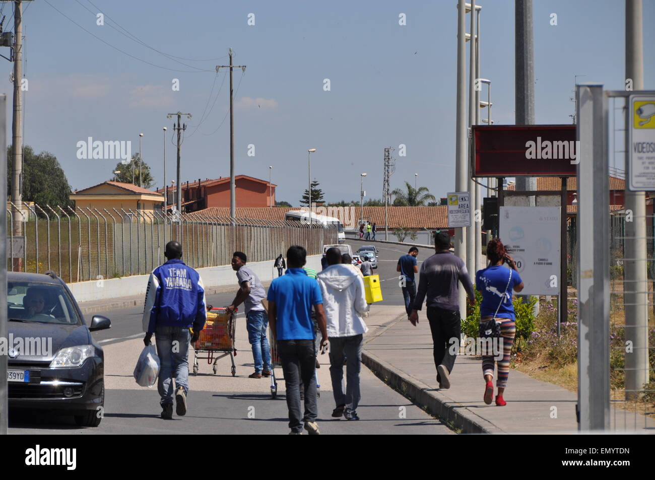 Migrants in the Mineo holding center, Sicily, Italy, Tuesday, April 22, 2015. Although the migrants can come and go as they wish, without proper documents it is useless to try to escape. According to the Director of the center there are currently over 3200 migrants, mostly sub-Saharan Africans who are spending years here waiting for political asylum. There are also over 200 ethnic groups at the center. (CTK Photo/Tereza Supova) Stock Photo