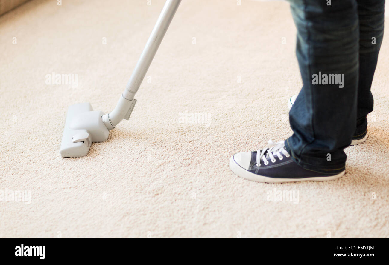 close up of male hoovering carpet Stock Photo Alamy