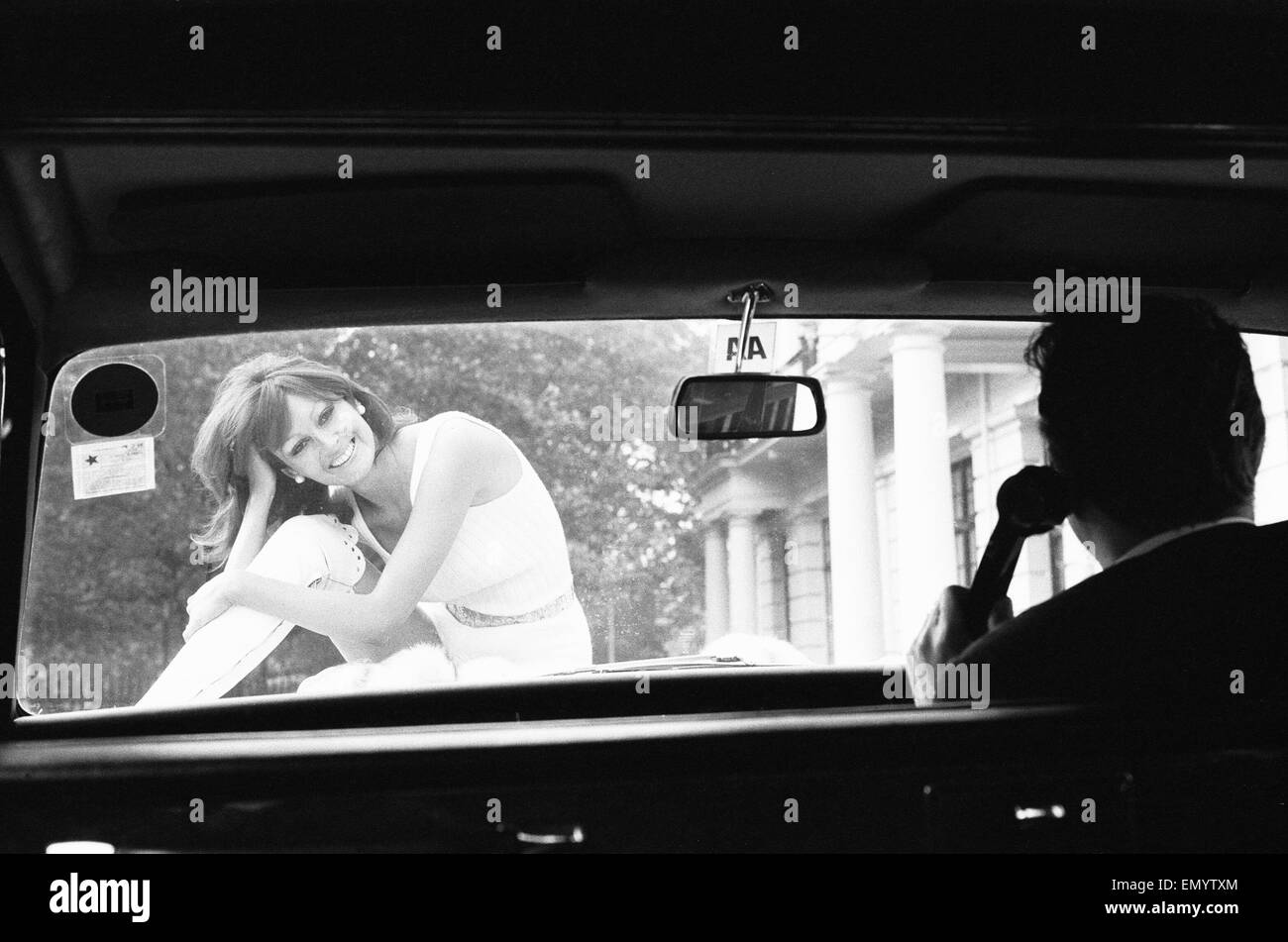 Lesley Russ photographed with her husband's car, Daimler Limousine, 'Silver Medallion' outside her London home in Hyde Park Gardens. 6th October 1972 Stock Photo