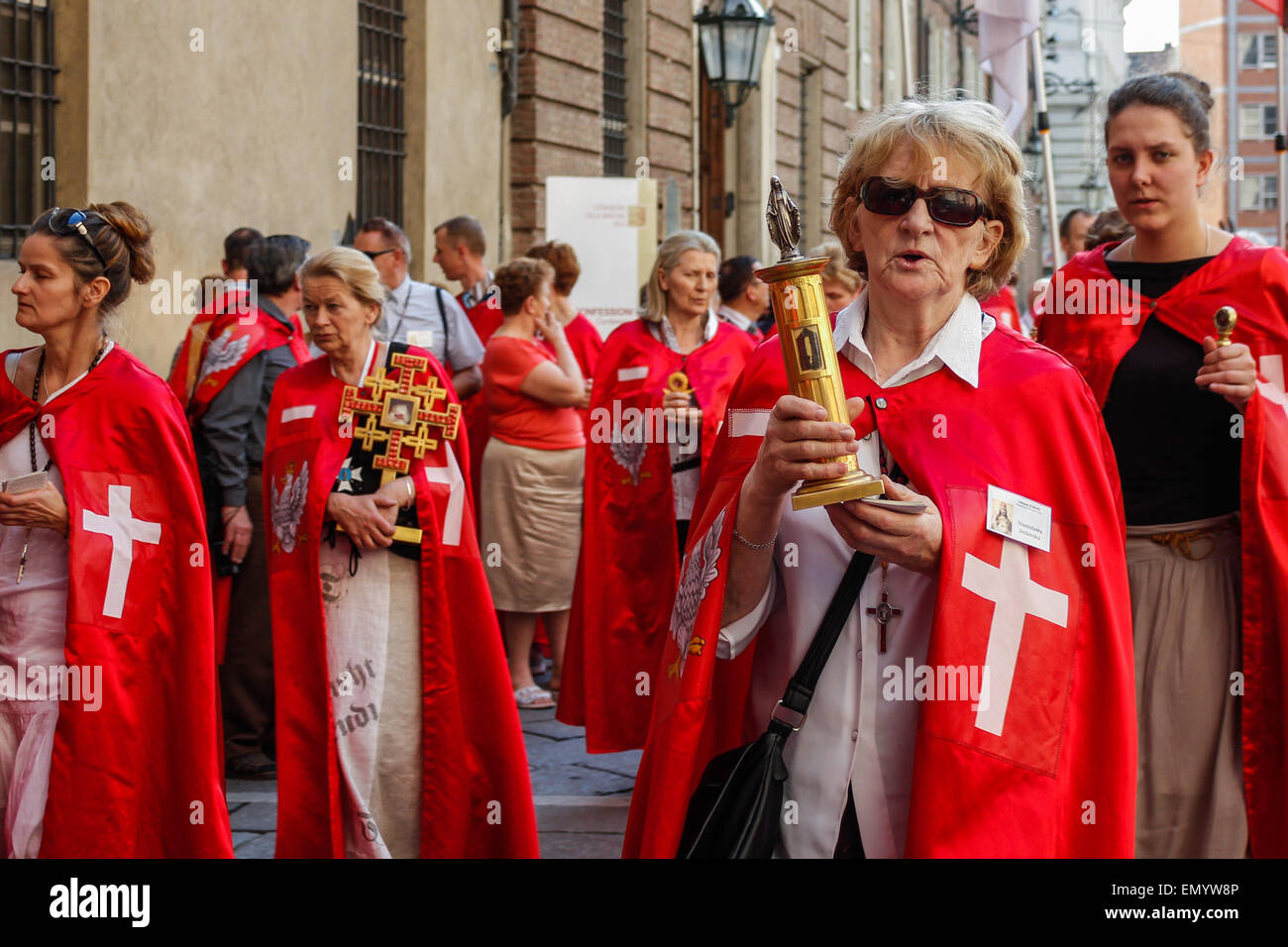 Torino, Italy. 24th Apr, 2015. A hundred faithful Poles, Cavalry of Jesus Christ the King, who visited the Holy Shroud. They are presented with red velvet and gold cloaks, hats ermine, statues of the Virgin Mary, crucifixes and holy cards to be distributed to the crowd. © Elena Aquila/Pacific Press/Alamy Live News Stock Photo