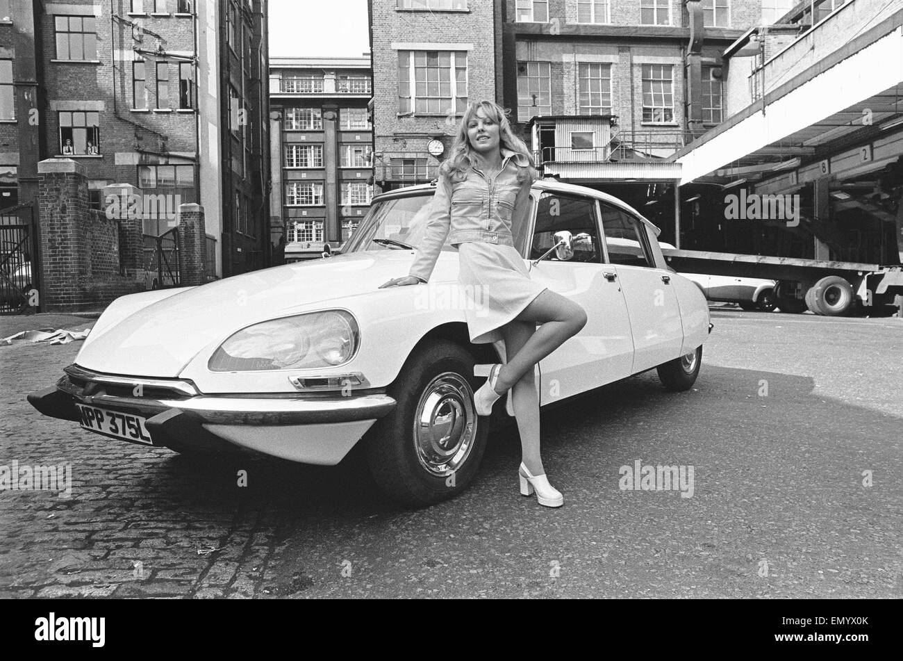 Reveille model seen here posing with a Citroen DS car which is a top prize in the Reveille win a car competition circa 1972 Stock Photo