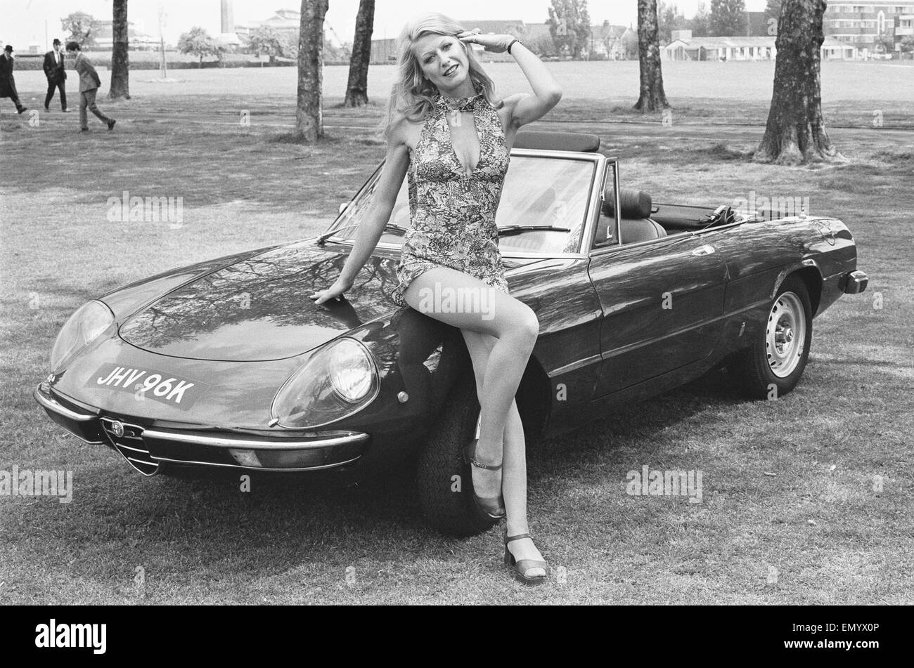 Reveille model Heidi seen here posing with an Alpha Romeo which is top prize in the Reveille win a car competition circa 1972 Stock Photo