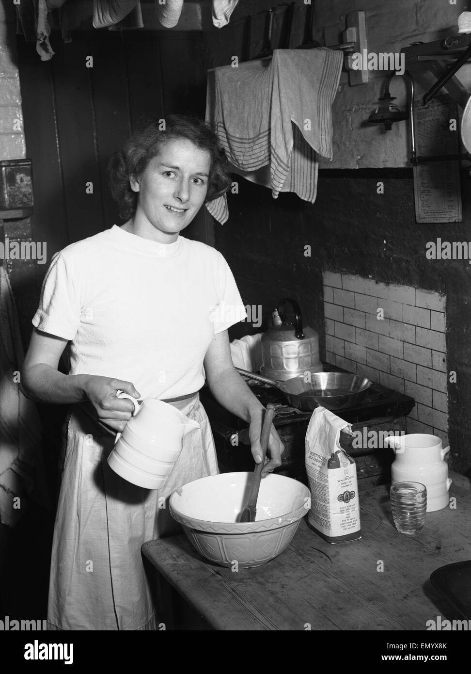 Woman seen in the kitchen baking Circa February 1952 Stock Photo