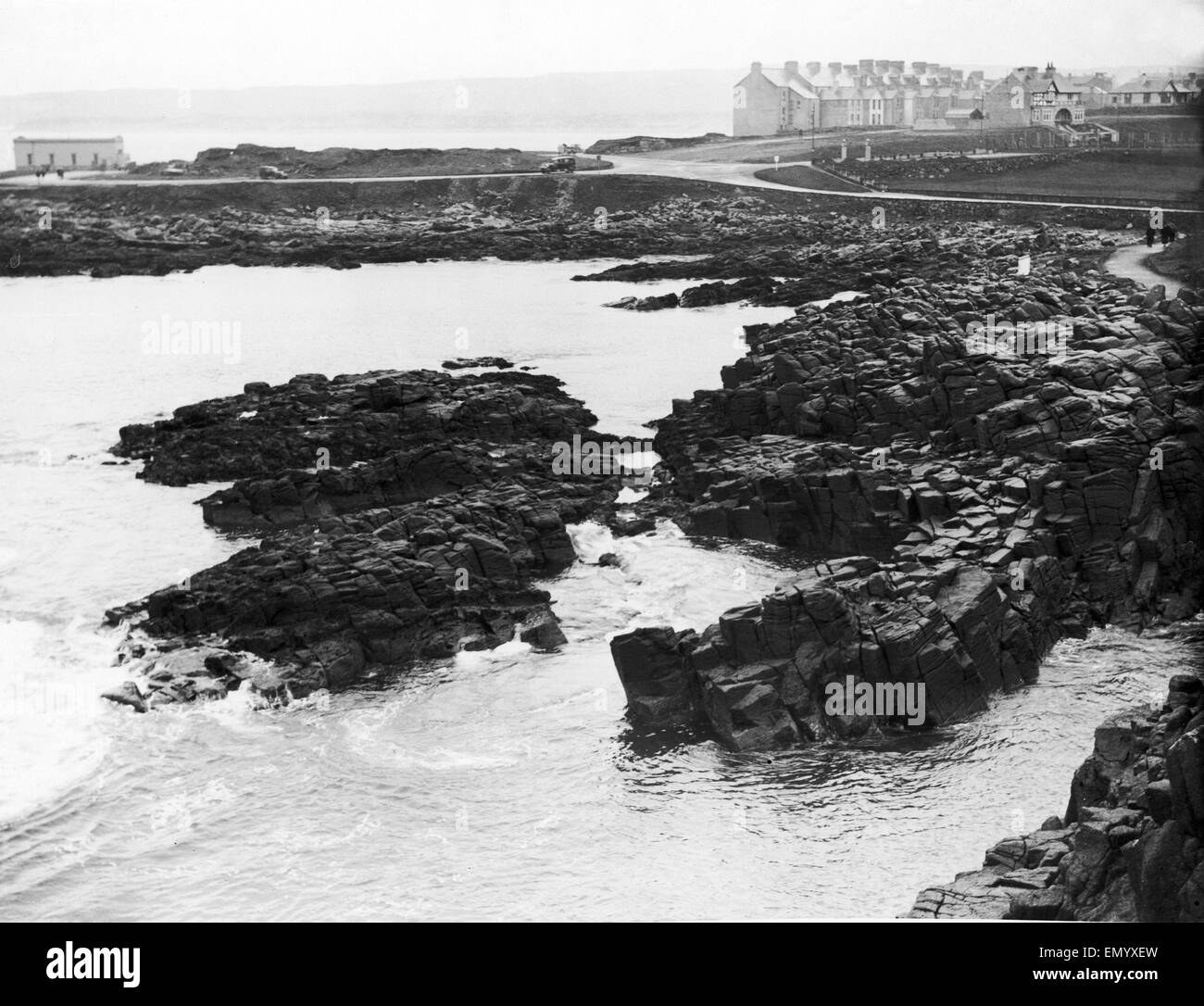 The rocky coastline near Portrush in County Londonderry Northern Ireland. 25th April 1928 Stock Photo