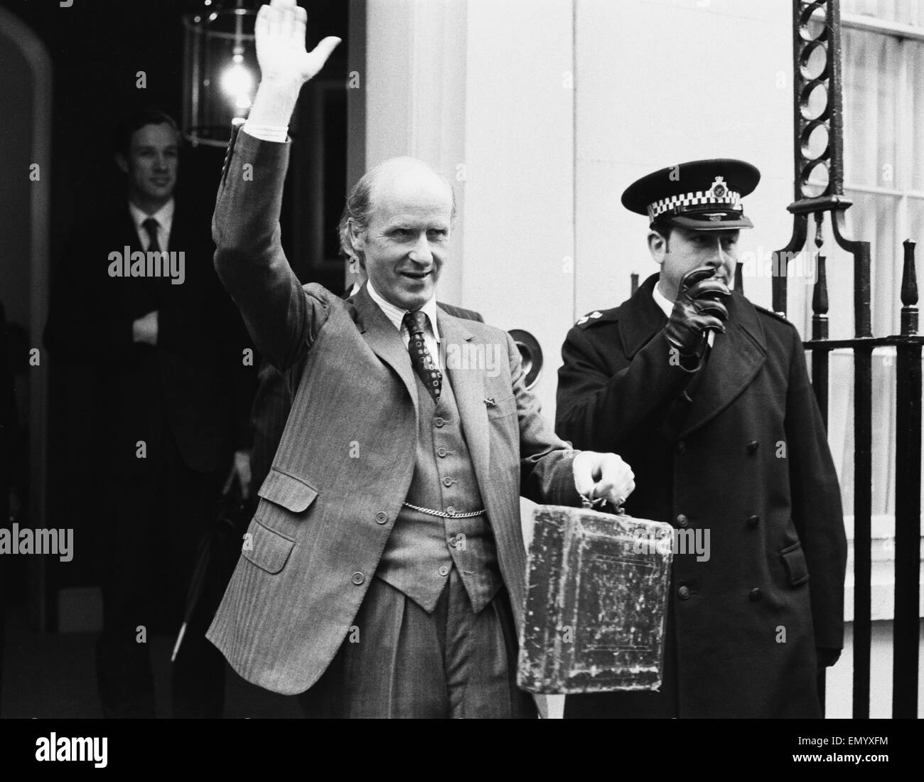 Chancellor of the Exchequer Anthony Barber waveas as he holds his red budget box on leaving number 11 Downing Street for the House of Commons. 6th March 1973. Stock Photo