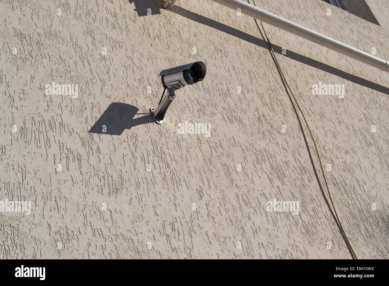 CCTV security camera attached to a brick wall Stock Photo Alamy