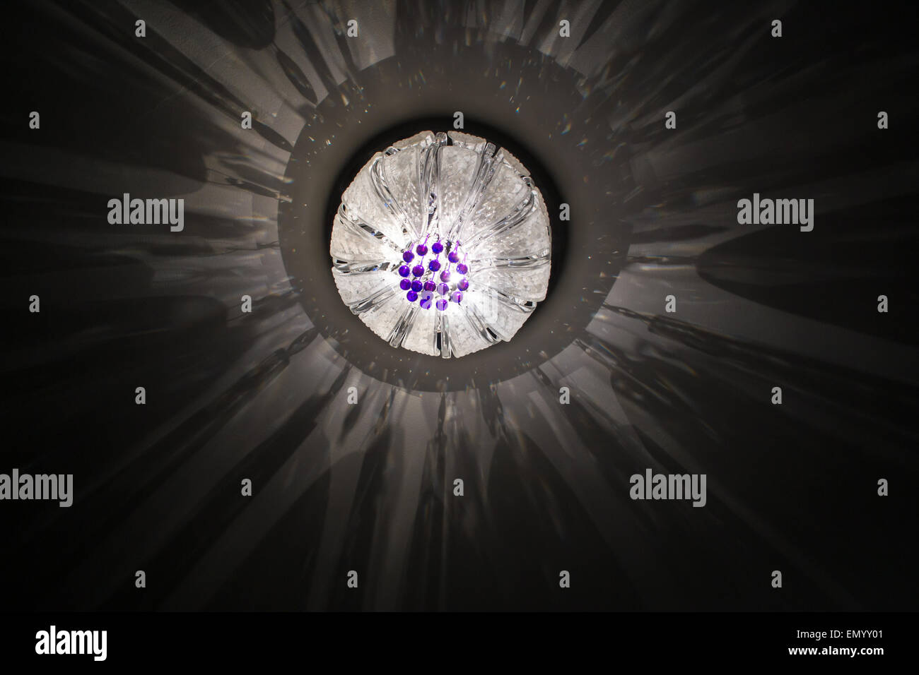 Bright Star Lights From A Ceiling Lamp Creating A Mottled Effect