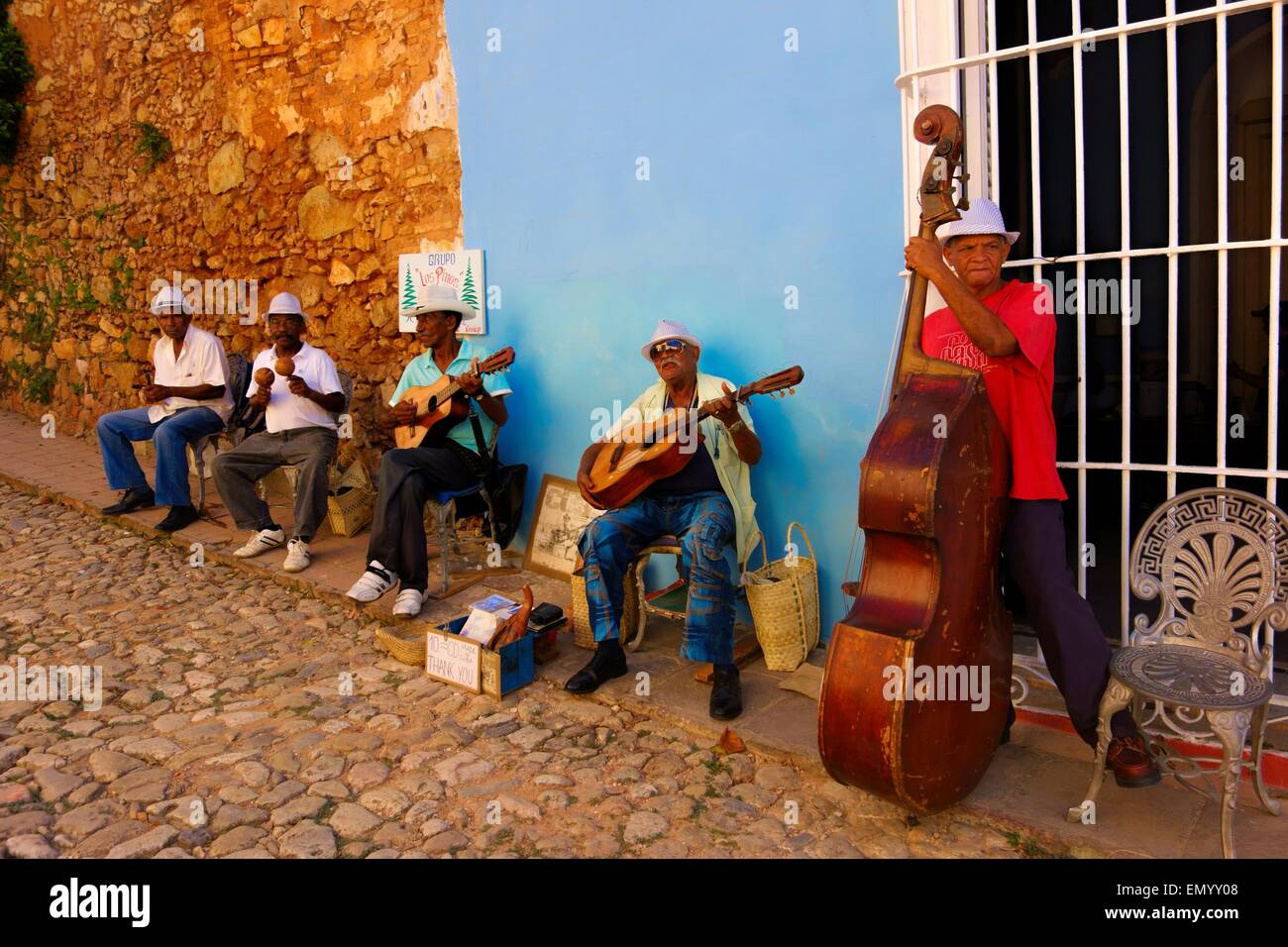 Male Cuban street musicians playing Cuban music the streets of Trinidad, Cuba Stock Photo