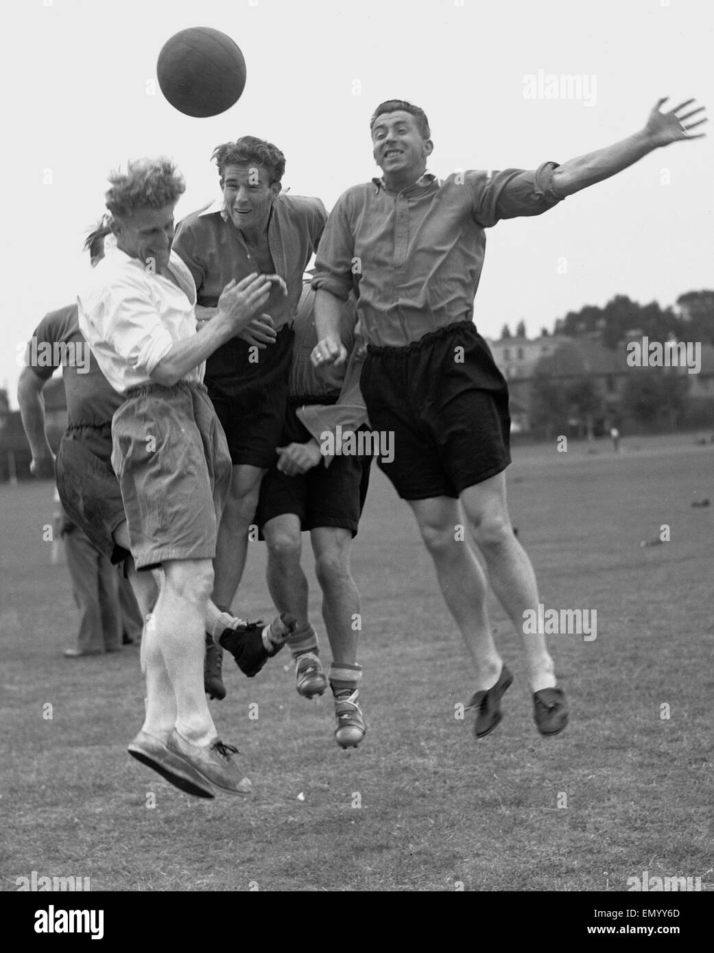 Malcolm Allison (centre) seen here heading the ball during a practise match at Charltons training ground 10th August 1950 Stock Photo