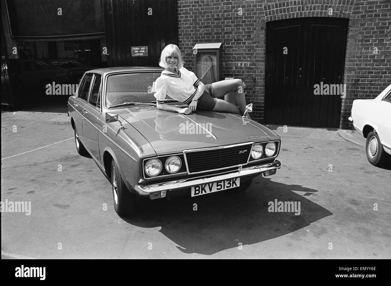 Reveille model Nancy Lee seen here posing with a Hillman Sunbeam which is top prize in the Reveille win a car competition circa 1972 Stock Photo