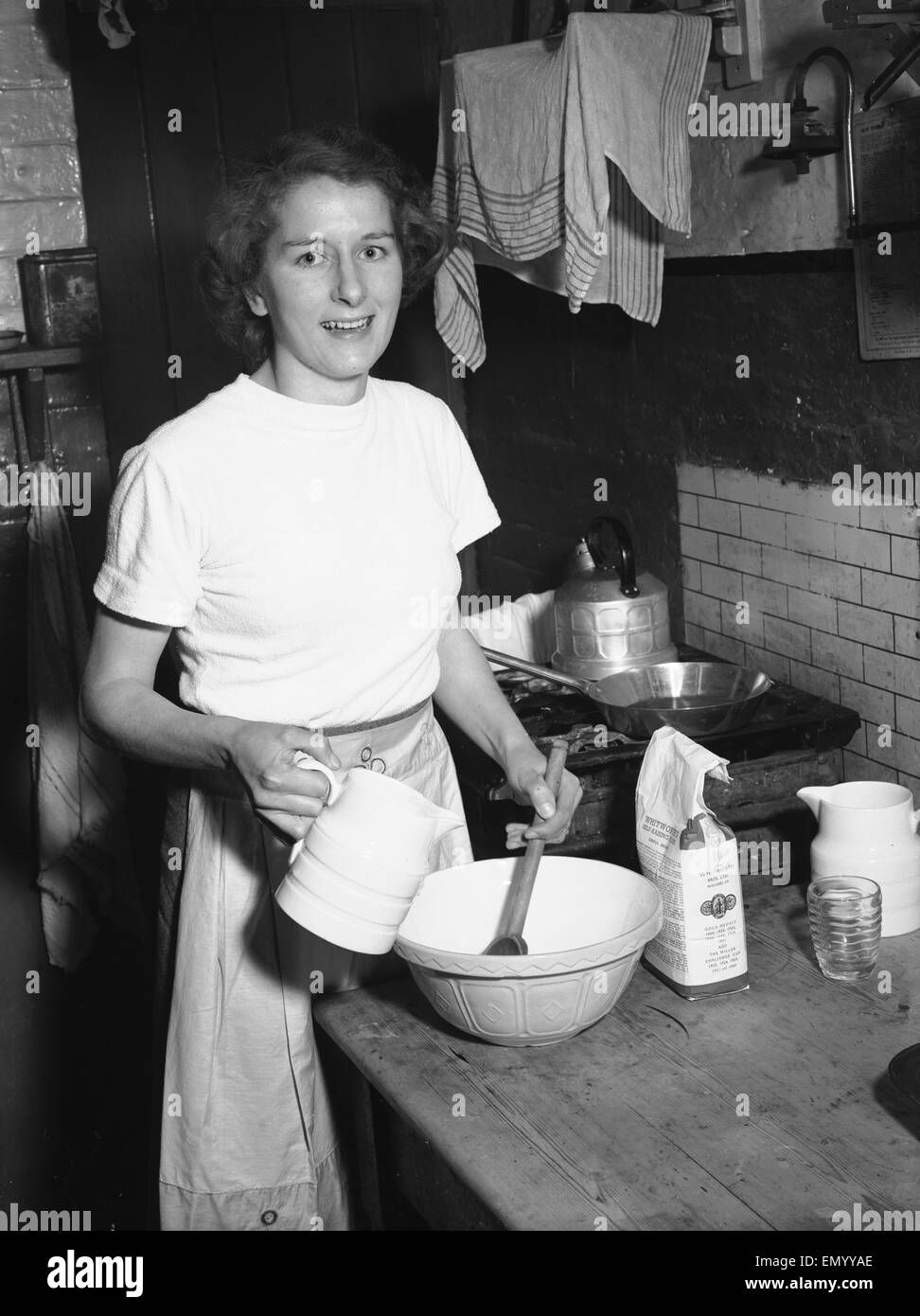 Woman seen in the kitchen baking Circa February 1952 Stock Photo