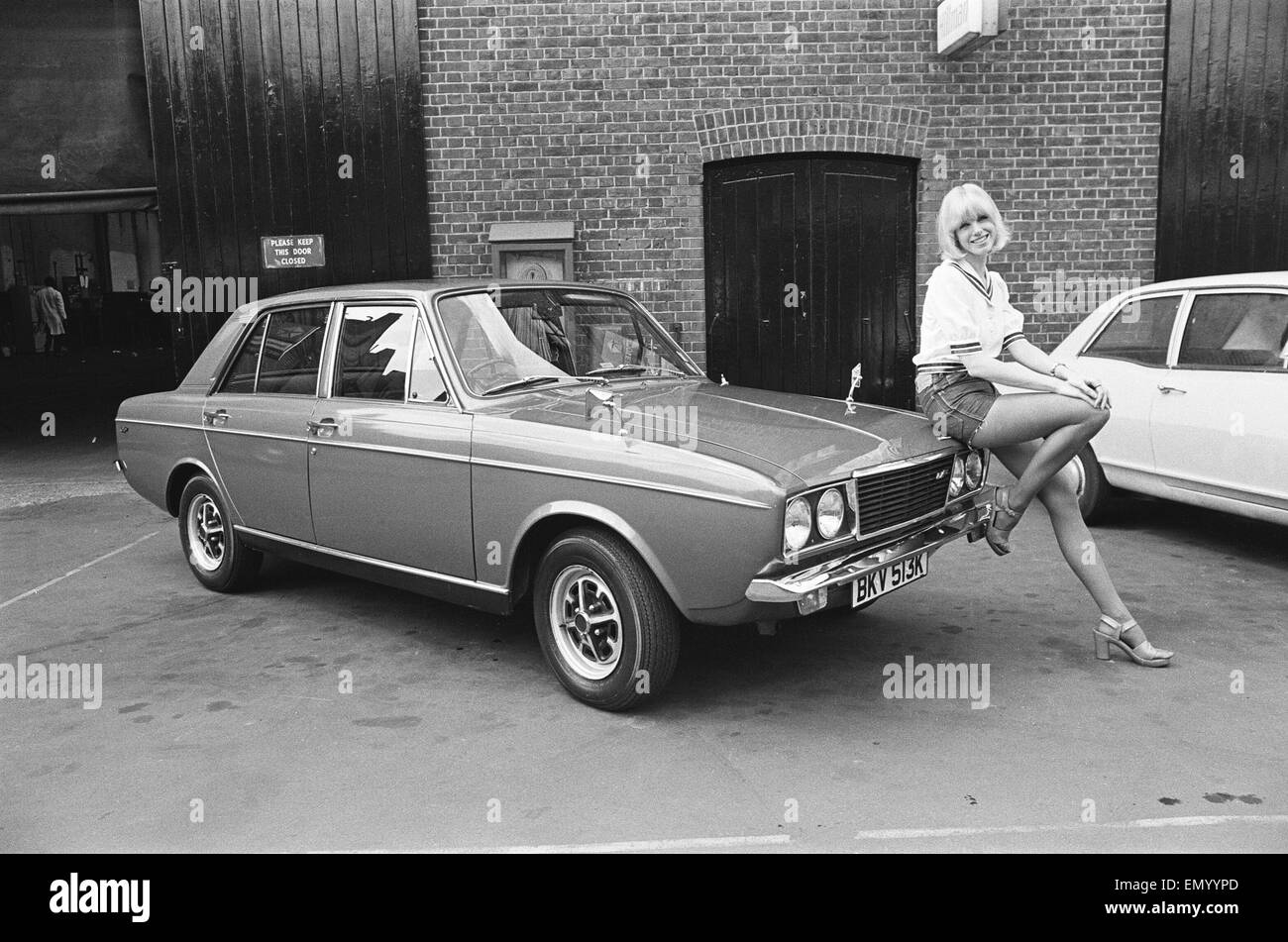 Reveille model Nancy Lee seen here posing with a Hillman Sunbeam which is top prize in the Reveille win a car competition circa 1972 Stock Photo